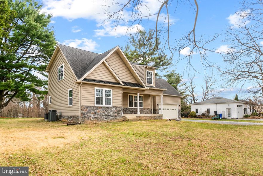 ***MAJOR PRICE REDUCTION, COME SEE IT NOW***WE MOVED OUT SO YOU CAN MOVE IN TODAY. Completely remodeled in 2013. Single family home with 2 car garage, main level bedroom with full-size private bathroom. Main level is an open space design, kitchen, dining, and family room, along with a half bath, hardwood floors, garage access and washer dryer/mud room. Three VERY Large bedrooms on second level, all include plenty of closet space. All four bedrooms come with ceiling fans. The washer and dryer, hot water heater, dishwasher, and microwave were recently updated after the remodel. We replaced the walkouts from the slider and mud room door, our goal was to build a large stone patio with a nice stone barbecue, but we never got around to it. Lower level is finished with full bath and a small unfinished workshop area, and a potato room (previous/original owners were farmers). I was told the home is situated on the highest point within a three mile radius. Before we purchased the home, I parked out front at 10:30pm, no trucks to wake you up in the middle of the night. Small telephone lines on Triadelphia Road, but no worries about those gigantic high voltage electricity cables, the home is no where near them. Triadelphia Ridge Elementary School and Folly Quarter Middle School are within walking distance of the home. No matter where you work, Rockville, DC, Columbia, Baltimore, Frederick, this location provides excellent access to Route 32 and Interstate 70. The home is located in "The Triangle" which is defined as => From Ellicott City take 29 to DC then take 270 to Frederick, then take 70 back to Ellicott City. Everyone in the world, the world, wants to live in "The Triangle".