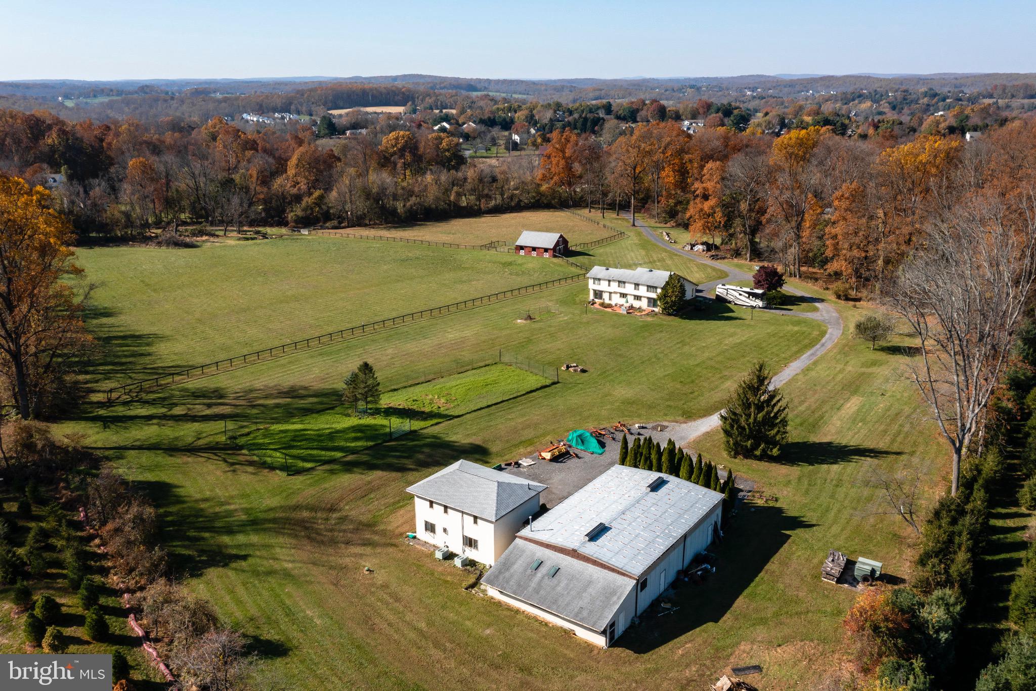 Welcome home to 280 Moore Rd- your own private retreat on 15+ acres in Downingtown School District featuring a 3000+ square foot contemporary style home, 5 stall Amish built barn with tack room, heated industrial shop building with additional workshop, and 2 story office building. This property sets secluded down a private drive yet minutes from all the conveniences the area has to offer- shops, restaurants, major transportation routes, Marsh Creek State Park and less than a mile from Shamona Creek Elem and Marsh Creek 6th grade center. The possibilities here are endless. Walk up the brick walkway to the 4bedroom, 3 full bath home. The unfinished house, featuring 2x6 construction, was completed when the current owners purchased the property in 1994. This included new electrical, plumbing, insulation, windows, doors, trim and basement flooring. Recent updates include new roofs (2012), water heater (2016), heating system (2016) and well pump (2017). The first floor features a family room with solid Hickory hardwood flooring(2013), 17’ vaulted ceiling, skylights and a wood burning stove(2011) which heats the house in all but the coldest days. There is also a dining room, pantry closet and a large kitchen with breakfast area. The kitchen has an abundance of custom cabinetry and stainless appliances. There is also another room currently used for an office but can also be used as a 4th bedroom. A full bath and laundry room with interior access to the oversized 2 car garage complete this floor. Upstairs there is a large owners’ suite with Jacuzzi and custom 60x36, 2 sided glass shower, 2 other generous sized bedrooms, a hall bath and a 4th room which can be used as an office, a bedroom (just needs a closet), walk-in closet, exercise room or nursery. The expansive unfinished basement provides plenty of storage space and bilco doors to the outside. Outside, there curved brick walks and a beautiful herringbone brick patio for you to relax and enjoy the tranquil views of the large organic garden. The property is relatively flat and allows plenty of uses- one of which is for horses and farm animals. The barn (1994) has 5 12x12 run-in stalls, a tack room, 8’ concrete isle, a full hay loft, water and electric. There are 2 pastures- one is 2.5 acres and the other is almost 6- the current owner hays the large pasture and everything has been well maintained. The 40x60 heated industrial building/machine shop with 14 foot ceilings perfect for a hobby enthusiast or to store boats, cars etc. There is also a connected 16x40 heated workshop with skylights and windows. The 2 story office building is 1532 sqft. The owners ran a small business from this building and has electric, water, sewage, a separate heat pump per floor, numerous office suites, a meeting room, a kitchenette, and a bathroom. The building could be converted to other uses, such as an in-law suite. This property is a hidden gem in bucolic Chester County. It is protected by ACT 319. SUBDIVISION is possible without losing ACT 319 status . All buildings are connected by data wiring and a security system, including fire detectors in barn. With so many possibilities, it is highly advisable that buyers considering the property for anything other than their own residential space should do their due diligence about permitted uses. Sellers are flexible with settlement. Do not miss this opportunity. .