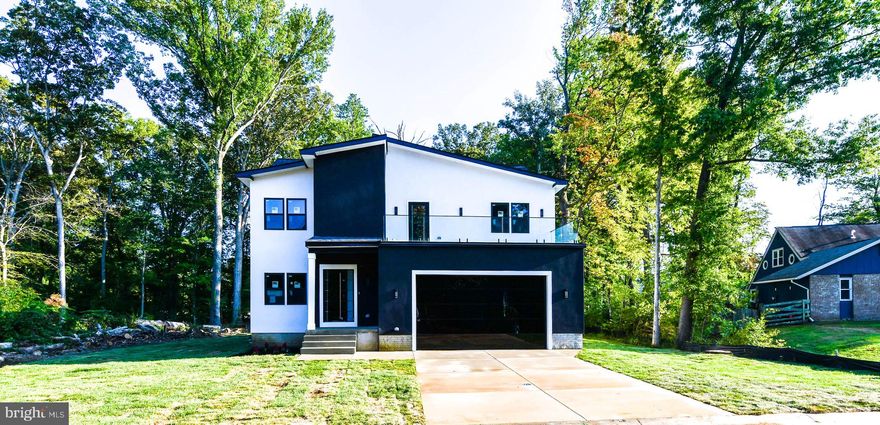 Buyer Financing Fell Thru -Brand New Construction Modern Home on a 1/2 Acre of flat land - No HOA Rules & No HOA fees:  5,000 Sq Feet of house on a private lot. We are Paying  $20,000 in Closing Costs Help.  

Over 100 Feet of private backyard space half wooded for privacy  - this would be perfect for a large pool, pool house, secondary garage space or outdoor Oasis!  Modern Contemporary Home comes with a Stucco finish with a stainless steel metal front door, glass balcony and glass mirror garage doors.  Move In Ready. 

6 Bedrooms, 4  Bathrooms Single Family House with Private Garage for 2 Cars with modern glass mirrored garage doors. This house has it all! Integrated Wireless Speaker and Audio System to play all your favorite music throughout the house.  Brand New Kitchen with SS Appliances, New Hardwood Floors throughout the main level, Glass Wine Cellar, Butlers Nook and Wet Bar in the owner suite. Main level comes with large 10 Feet Black Accordion Doors for easy access to your private backyard. Kitchen comes with a 8 Feet island and Walk In Closets in each bedroom. Inside boasts10 foot ceilings throughout the house. Includes two zone HVAC heating /Ac system throughout the house. 

Owners Suite comes with a large 25 Foot private glass balcony overlooking the neighborhood, perfect for nights of stargazing.

Full Basement comes with a finished bedroom, separate entrance and the remaining 1,500 Sq feet is currently unfinished. Basement does include two rough ins already installed for a full bathroom and basement wet bar. This area would be perfect for a separate office space, home based business, or in-laws, or AIR BNB.  NO HOA and NO Front Foot Charges. 

Property is located 1 mile from Bowie Town Center, 7 Miles from Crofton Shopping Center and 15 Miles from Annapolis.  Interstate 295, Route 301 and Route 50 are a 1 mile away.
