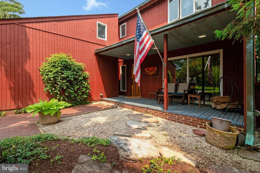 Beautiful Mid-Century Modern style Contemporary in the Heart of Falls Church City.  One-of-a-kind home designed by renowned architect Paul Barkley FAIA, receiving an Excellence in Design Award from the Village Preservation & Improvement Society.
Spacious 3BR/2.5BA Home full of character at every turn, with a welcoming Front Porch overlooking Landscaped yard.  Main Level features a country style kitchen w/ Viking Appliances, Dining room with Cathedral ceiling, Breakfast area with Skylight, opening to a Large Family Room w/ floor-to-ceiling windows overlooking a fenced backyard. Separate Formal Living Room w/ Fireplace, Office/Den (which can easily convert to 4th Bedroom), Half-bath and Dark Room/Storage area (plenty of room to add a full bathroom). Walk down a spiral brick staircase to your private Wine Cellar!!
Upper Level Primary Bedroom Suite with vaulted ceiling, Fireplace & separate sitting area which exits to a private balcony overlooking the backyard.  Primary Bath w/ walk-in dressing area and closet, plus two additional closets in the bedroom.  Second Large Bedroom with separate area perfect for additional bed or desk area, plus separate arts & crafts room, cedar closet, walk-in closet & loft area.  Plus a Third bedroom and second full bathroom.
Backyard features Beautiful Landscaping, Mature plantings & small pond water element w/ waterfall, making for a peaceful serene experience.  Solar Panels supply Hot Water throughout the Home.  Spacious Two Car Garage, plus additional Driveway Parking. 
Centrally Located only a Block from the W&OD Trail, and the New Founders Row Shops & Restaurants.  Less than a mile to West Falls Church Metro Station (Orange Line), and only two miles to East Falls Church Metro Station (Silver & Orange Lines).  Less than a mile to the Falls Church Community Center (also designed by Paul), Farmers Market, and Downtown Falls Church shops and restaurants.  Easy Access to 
I-66, I-495, Routes 29, 50 & 7 w/ short commute to Washington D.C. and the Pentagon.  Falls Church City School Pyramid w/ newly constructed Meridian High School.