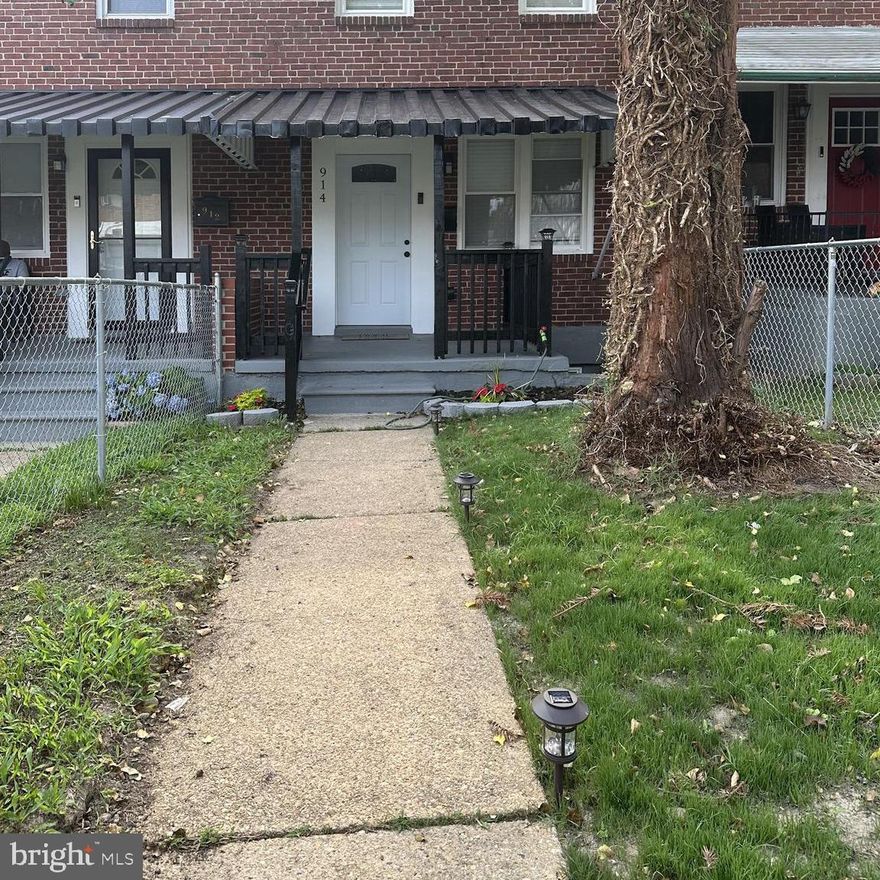 Welcome Home to 914 Whitmore Ave! This stunning 2 bedrooms and 2 baths renovated home offers endless modern comforts and style throughout three-levels. The main level boasts an open concept with coffered ceilings, new luxury vinyl plank flooring and a spacious living/dining area. The charming kitchen delights with stainless steel appliances, quartz countertops, and custom cabinets. A covered porch can be found off the kitchen with a fully fenced in backyard and parking pad. The finished lower level offers extra living space, a custom laundry room with quartz counters and full bath. Upstairs, you'll find 2 primary suites with modern fixtures and another full bathroom. This home is move-in ready with local shopping, parks, Coppin State University, and major routes like Route 83 and I-695!