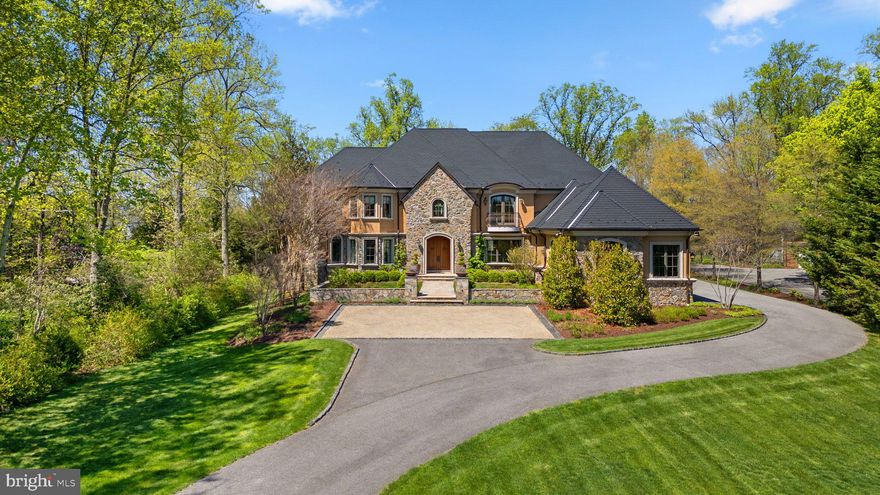 One-of-a-kind Waterfront Luxury in Annapolis, Maryland! Secluded on 2.59 lush, park-like acres along the shores of one of the Chesapeake Bay’s most serene and protected tributaries, this exceptional estate offers an unparalleled blend of privacy, elegance, and premier waterfront living rarely found in Annapolis. From the moment you arrive down the tree-lined drive, a sense of calm and sophistication sets in. With 185 feet of pristine shoreline, deep water, and a private pier with boat lift, this is more than a home, it’s a relaxing  destination where every day feels like a retreat. 
Spanning over 12,000 square feet, this custom-built estate (main floor finished in 2014 by Pyramid Builders, lower level in 2019 by Bayview Builders) is crafted with the highest-quality materials and top-of-the-line features. Every detail has been curated with uncompromising quality to deliver a life of luxury, comfort, and effortless entertaining. This resort-like home is built to host—from elegant galas with ample onsite parking to relaxed family weekends. Inside, sunlit spaces and radiant-heated floors create a warm, welcoming  atmosphere throughout the year. The grand two-story foyer with custom millwork ceiling opens  to formal living and dining rooms, while the heart of the home—a soaring great room with fireplace—anchors the space with timeless beauty and comfort. A chef’s dream kitchen is equipped for both daily living and high-end entertaining, featuring Sub Zero refrigerators and wine cooler, Wolf stove/griddle and double ovens, dual dishwashers, warming drawers, catering entrance, ample custom cabinetry, and expansive granite countertops. Whether preparing an intimate dinner or a large event, this space delivers  excellence. For gathering and unwinding, the custom mahogany bar with private balcony overlooking the  waterfront and pool is located on the main floor and connects to the kitchen by the great room–perfect for serving pre-dinner cocktails or spreading out larger gatherings. A comfortable  family room and sunroom off the kitchen overlook the waterfront and pool providing relaxing  sunset views. A main-level guest suite with private balcony ensures both comfort and privacy for visitors while a sun-filled custom wood paneled office with fireplace provides an impressive and inspiring executive workspace at home.  
Ascend the stunning curved staircase to the primary suite for a serene escape with water views and attention to all your needs with sitting room, fireplace, dual dressing rooms, a private  balcony, and a spa-like en-suite bath. Three additional en-suite bedrooms, a laundry room and an upper-level library offer generous, luxurious accommodations for family and guests. 
The newly finished walkout lower level feels like its own private coastal escape: game room,  kitchenette, home gym, a 2nd laundry room, pool bath, sauna, and guest quarters with private  entry—perfect for an au pair, in-laws, or long-term visitors. Step outside and discover a resort caliber setting: a heated saltwater pool and hot tub surrounded by travertine patios, Ipe decks, and outdoor dining areas that invite celebration and quiet reflection alike. Cruise effortlessly from your backyard to the Chesapeake Bay, South River, Annapolis Harbor and St. Michaels for waterfront dining or explore the many nearby creeks and coves. Whether you're boating, catching crabs off the dock, taking in the bald eagles during sunset, or paddling into calm morning waters, the connection to nature and the water here is effortless. Conveniently located just minutes from downtown Annapolis and within easy reach of  commuter routes to Washington, D.C. and Baltimore, this extraordinary estate defines luxury living. This is more than a home—it’s an estate that offers a luxurious lifestyle immersed in nature, rooted in comfort, and ready to be shared. Embrace this rare opportunity to own an exclusive piece of Annapolis where luxury meets tranquility!