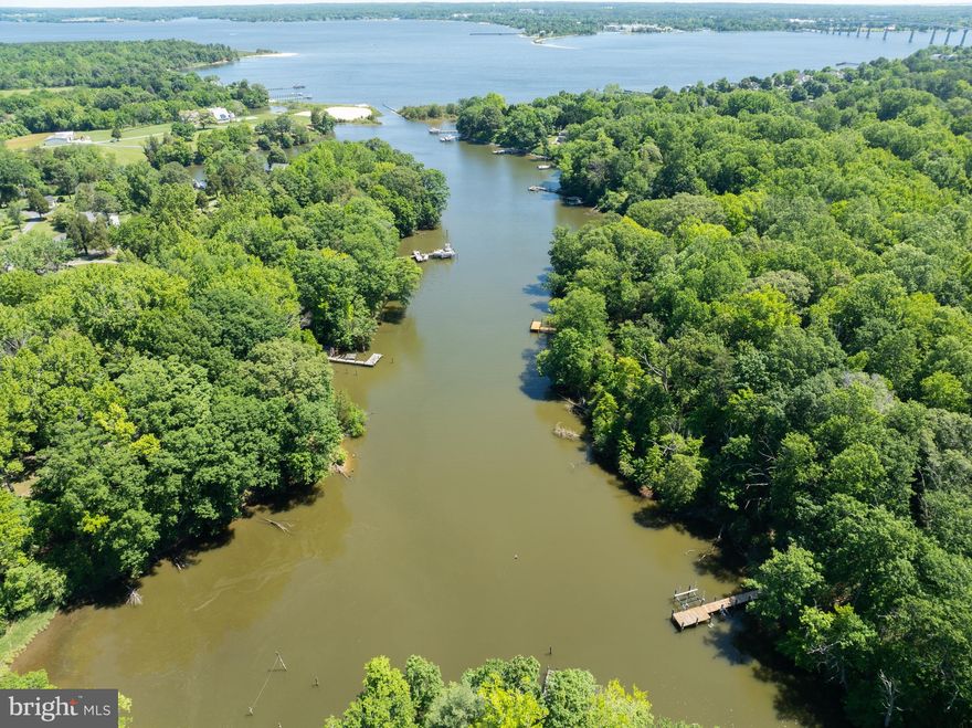 Price adjustment!!!!!  Check the inventory for buildable waterfront lots with recorded perc off the Patuxent! There are NONE except this one. Why buy and older house for over $600K tear it down and spend a ton to rebuild??? Buy this lot and build your dream home. Actual lot size is to 2.69 acres (with 216 ft of sheltered shoreline)  GREAT DEAL ON REAL BUILDABLE WATERFRONT LOT! No Marshland....NO APPOINTMENT NEEDED- Go and Show! Deep sheltered waterfront just off the Patuxent River. Minutes to Solomon's and the Chesapeake Bay. Best priced buildable waterfront lot in St Mary's County with real waterfront for a boat and close to everything- Base, shopping, fishing, boating on Patuxent/Chesapeake Bay, and restaurants on the water!!!!! If you are a serious waterfront buyer you know what's on the market and you will agree this is a great deal!!!! If you want sheltered deep water just off the Patuxent close to Solomon' s -This is it!!!!  Pier permit in hand! Check out aerial photos of lot and creek.
NO APPT Required to show. Vacant lot.