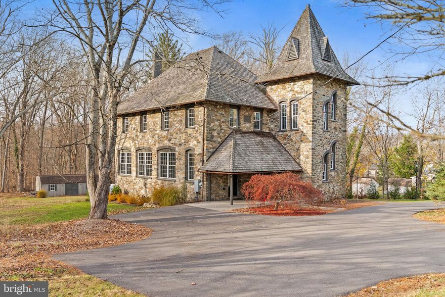 This historic property was originally constructed in 1887 as the Franklin School and has been fully renovated into a unique residence that blends preserved architectural elements with modern finishes and mechanicals.

The main level features an open floor plan with 12’ ceilings, exposed stone, original beams and posts, and reclaimed wood throughout. A full wall of Low-E glass windows provides abundant natural light and views of the surrounding mature trees. The kitchen is equipped with an ILVE 48” dual-fuel range with seven sealed burners and griddle, ZLINE hood, Frigidaire Professional refrigerator and freezer, and a 4’x12’ island with sink and under-counter refrigerator. A centerpiece gas fireplace and direct access to the massive deck complete this level.

A custom stair tower leads to the second floor, which has the primary suite, laundry and second bedroom. The private primary suite is designed with 11’ ceilings. The 9’x9’ wet room includes original natural stone, reclaimed slate from the school’s chalkboards, a free standing soaking tub, and two multi-jet showers. The primary also includes a walk-through closet/dressing room area with cabinetry. The laundry room has built in cabinetry and utility sink. The second bedroom has a study nook and full bathroom attached.

The third floor offers two additional bedrooms, a full bath, exposed beams, and a spacious loft area.

Situated on approximately 1.6 acres, the property features mature trees and a woodland setting with farmland surrounding. The building previously served the community as the Franklin Public School and the Wyebrook Missionary Baptist Church before its residential conversion. Recent improvements include new HVAC systems, Low-E windows, and a propane-fueled automatic generator.

This property offers character, privacy, and a thoughtfully designed renovation throughout.