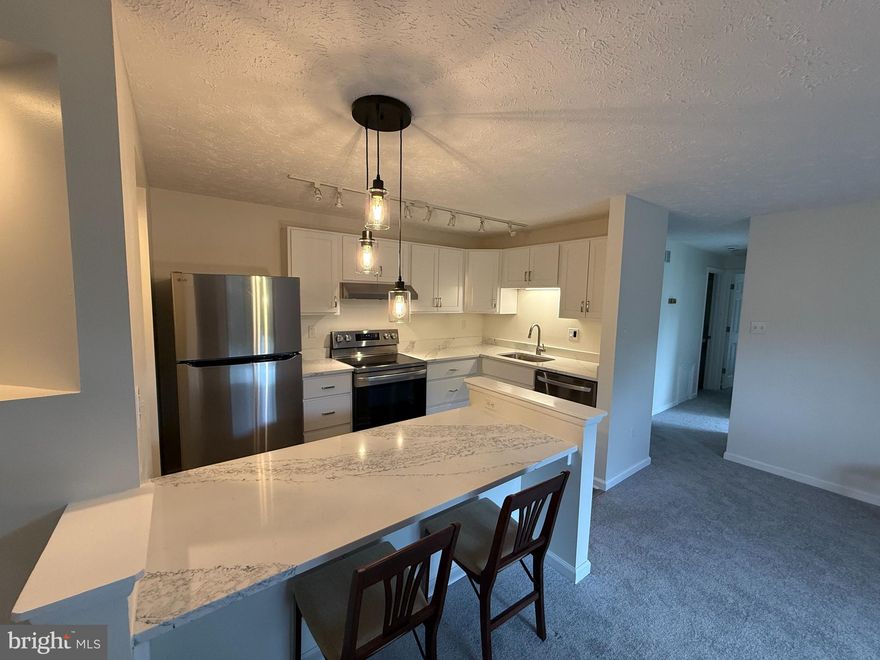 Two bedroom, one bathroom apartment, with new kitchen cabinets, countertops, and LG appliances, available now.

12205 Peach Crest Drive, Unit D, in the Germantown condominium community of the Knolls at North Lake, is a beautiful 858 square foot ground floor apartment. It features a full kitchen and adjacent living room/dinning area, with a private patio off of the living area. The remodeled bathroom includes a full sized bathtub, toilet, pedestal sink, and a storage cabinet.  Laundry facilities include new full sized clothes washer and dryer inside the apartment. Storage space includes large closets in both bedrooms, and a large storage closet off of the outside patio. The entire apartment has been freshly painted and has new carpet and floor covering.

One reserved parking space is included, along with ample parking for guests and visitors.  Snow removal, lawn care, and landscaping services are all provided by the condominium.  Trash removal, recycling, and water and sewer utilities are also included. The tenant will be responsible for an account with PEPCO for electrical service.

The Knolls at North Lake Condominium is one of several communities that make up the North Lake Village Federation.  The Federation owns and maintains Gunner’s Lake, the bike trail around the lake, two swimming pools, and tennis courts.  Family or individual pool memberships can be purchased by residents of the condominium.

The apartment is conveniently located within minutes of major commuter routes, the Germantown Town Center, the Department of Energy, South Germantown Recreational Park, Seneca Creek State Park, the MARC train, and is within walking distance of schools, bus routes, and Gunner’s Lake.