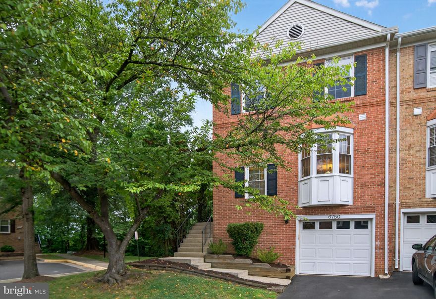 Welcome to 6750 Cardinal Woods, Lorton, VA – where modern elegance meets exceptional convenience!

This stunningly updated end-unit brick-front garage townhome offers 3 spacious bedrooms, 2 full baths, and 2 half baths, ideally located just minutes from Fort Belvoir, the Springfield-Franconia Metro, major commuter routes, Kingstowne Town Center, and the always-popular Wegmans shopping center.

Step inside to discover a home filled with tasteful, high-quality updates, including plantation shutters, top-of-the-line stainless steel appliances—featuring a premium Bosch dishwasher—and a fully renovated, chef-inspired kitchen with custom cabinetry and pull-outs. All four bathrooms have been beautifully remodeled with detailed tile work that adds an elevated designer touch. Gleaming hardwood floors grace the main living areas, while the bedrooms feature brand new, upgraded plush carpeting. Freshly painted in a warm, neutral palette, the home feels both sophisticated and move-in ready. The luxurious primary suite offers a serene retreat, while newer windows, newer doors, and a brand-new roof (2025), and new HVAC (2022) provide comfort, style, and peace of mind.

The spacious walk-out lower-level recreation room showcases engineered hardwood floors and opens to a fully fenced backyard oasis backing to mature trees—perfect for privacy and outdoor enjoyment. The expansive deck overlooks the tranquil wooded backdrop, with stairs leading down to the yard and a large storage shed tucked neatly under the deck. A full-size washer and dryer, discreetly hidden behind a stylish barn door, adds charm and convenience.

Being an end unit means you’ll enjoy extra yard space and enhanced privacy—a rare find in townhome living. Parking is effortless with a garage, driveway, and two additional parking passes—four dedicated spots in total.

The Cardinal Woods community offers an array of amenities, including a basketball court, tennis court, playground, swings, open grassy fields, and scenic wooded walking paths.

This is more than a home—it’s a statement of style, comfort, and location. Don’t miss your opportunity to own a beautifully upgraded, ideally situated end-unit townhome with exceptional features inside and out!