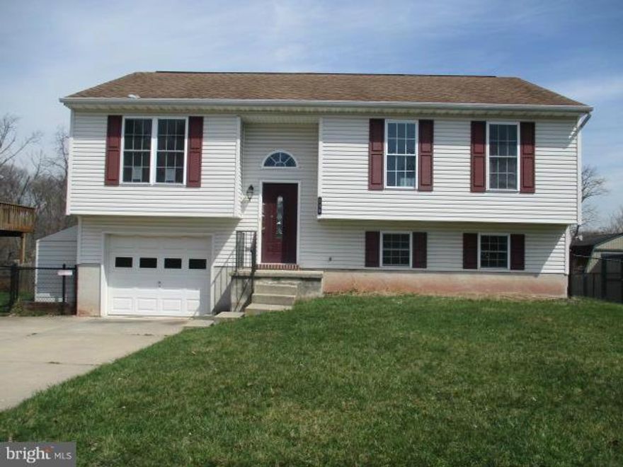 Spacious split foyer offers 3 bedrooms and 2 baths on main level. Open  floor plan for living, dining and kitchen area . Huge kitchen with lots of cabinet space. Basement is finished with walk out level. Has family room & half bath. Front loading garage  and off street parking. Nice size back yard with open view. Close to Taneytown and Westminster. OWNER OCCUPANTS 1ST 15 DAYS INVESTORS APRIL 17TH