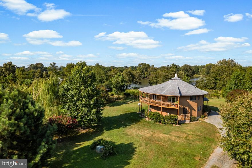 Located on a scenic Creek of the Gross Coate Farm just minutes to Easton. A long private driveway leads to the fifteen plus acre site with wonderful elevation and amazing views. A nature lover's paradise. This home was built and designed by Deltec Homes.  Every detail of every Deltec home is intentionally designed to create a Real Connection for people and the planet. That means they engineer homes that are able to withstand even the worst of weather conditions. They create homes that exist in harmony with the natural world.  The flooring on the main level is Bamboo and the upper level Brazilian Walnut. The spacious home with first floor primary bedroom suite and two additional bedrooms upstairs has an open kitchen with Hickory cabinets and a family room with gas burning fireplace, private library/offices and waterside views of Gross Creek just off of the Wye East River.  There are plenty of native plantings and great opportunities for wildlife sightings.  The floating dock offers a great way for launching kayaks and canoes. The home sits on a high elevation, therefore no flood insurance required. Part of the acreage is farmed by a local farmer with a contract that ends on December 31, 2024. Looking to work from home, recently equipped with fiberoptic for fast speed internet through Easton Utilities. More photos to come.