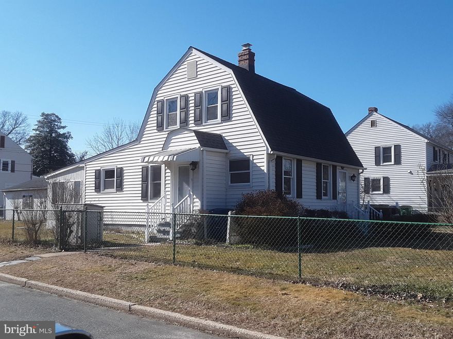 This home is renovated and ready!! It features large living room  and separate dining room with beautiful hardwood floors! Galley kitchen with 42in oak cabinets built in microwave and side-by-side refrigerator, first floor owner's bedroom with a full bath that is situated so that it can be used as part of the owner's suite or as a bath for the fist floor as well. There is a huge four season sunroom that can also be used as part of the suite or for family space. The sunroom has a pellet stove and in-wall air conditioning unit, carpet and sliders to the side yard. The second floor features two bedrooms and a full bath. The lower level has a laundry (washer and dryer remain and is as-is) and lots of room for storage. The property is situated on a corner lot and has an alley behind it that gives you access to a huge 20X24 detached two car garage with auto garage door opener and park a couple of cars, a boat or your RV on the additional parking pad that along with the entire  property is surrounded by chain link fencing! Rubbermaid shed and metal shed included as-is.