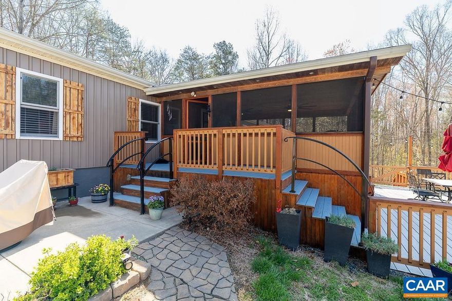 OPEN HOUSE SUNDAY, MAY 17TH FROM 11:00 TO 2:00......Beautifully renovated, this home offers the perfect blend of privacy and convenience?located just 5 minutes from Zion Crossroads, 25 minutes to Charlottesville, and 45 minutes to Richmond. Step inside to find a spacious and inviting layout, anchored by a cozy wood-burning fireplace.  The kitchen is designed for both everyday living and entertaining, offering granite countertops, appliances 5 years old and wine cooler.   The primary suite provides a relaxing retreat, private en suite bath complete with a jetted tub and separate walk-in shower. A split-bedroom floor plan offers added privacy, with a total of four bedrooms to accommodate family, guests, or home office needs. Enjoy outdoor living at its best from the screened-in porch, overlooking a large pool?perfect for entertaining or relaxing all summer long. The spacious pool deck includes additional storage and plenty of room for seating and gatherings. Additional features include a two-car garage with a lean-to for extra storage. Trex decking on the back deck, and thoughtful upgrades throughout. The home is equipped with instant hot water, a roof and appliances less than 5 years old.