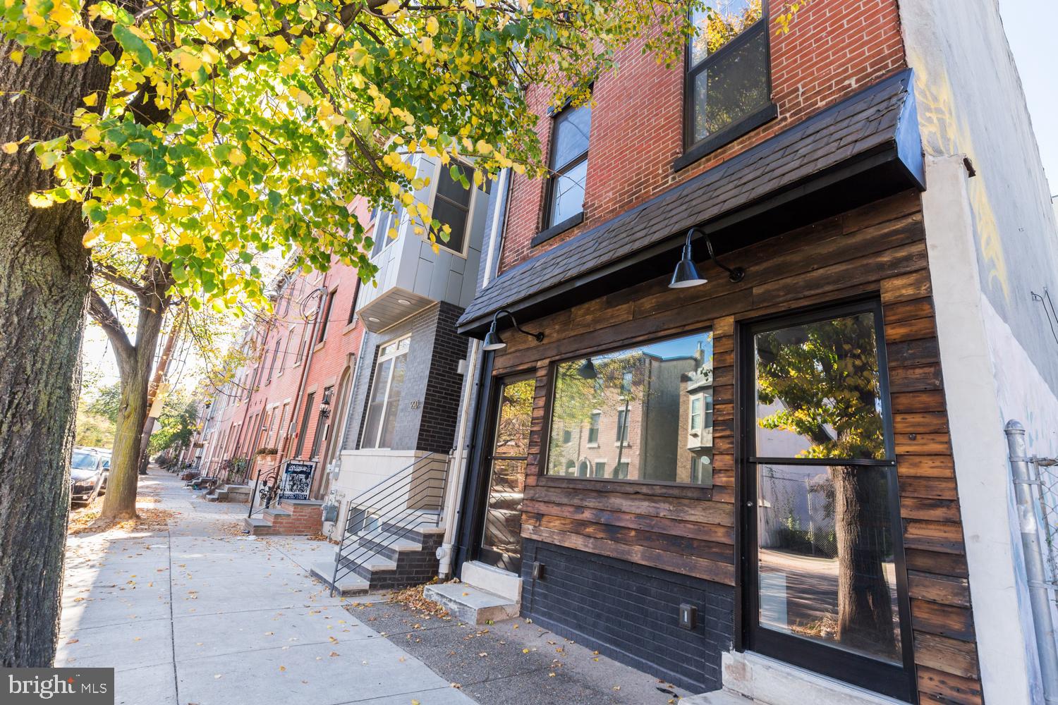 Welcome to 992 N 5th St., a remarkable duplex opportunity in Northern Liberties! Live in one of the units, and rent out the other. This building proudly features thoughtful elements in its appearance: exposed brick, exterior barn lighting, cedar wood siding, and a newly-pointed slate awning make it stand out. Tenants enjoy two separate entrances. Enter Unit 1 on the right (which is bi-level) to see beautifully restored pine plank flooring, ample living and kitchen space, and a convenient half bath. The double glass sliders in the rear open to a large outdoor area, which the tenants of Unit 1 get to enjoy privately. Unit 1 has access to a full, dry storage basement. Up the stairs in the same unit are three large bedrooms and two updated full bathrooms. Unit 2 is entered through the left door of the building. This 1-bedroom apartment gives a loft feel with high ceilings, concrete slab countertops, and wooden rafters. Ductless mini-splits and tankless hot water heater boast modernity despite the rustic character. As for this building's location: it's hard to beat! You're a quick walk from all things Fishtown/Northern Liberties, especially the sought-after Girard/Frankford corridor. Bus routes, subway access, and parks are nearby. This opportunity is fantastic for an owner-occupant looking to make the leap into real estate investment, or for a seasoned investor looking to add an income-producing asset to their portfolio. We can't wait to have to you come by!