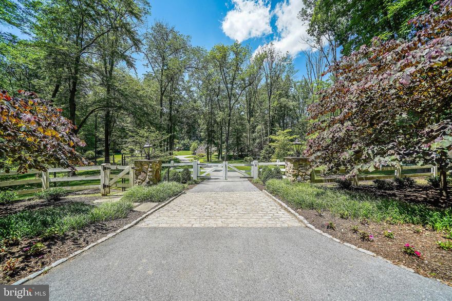 Elegance. Privacy. Comfort. Convenience. All four (and more) come together at 400 Dutton Mill Road, an exclusive estate nestled on 4.7 pristine acres in the prestigious Radnor Hunt community in Willistown. This secluded oasis features a 5,000+ -square-foot main house, ample outdoor space with landscaped gardens, winding walking trails, and a resort style pool, and stunning views of the surrounding countryside for the best in Main Line living.The gated entrance welcomes you up a stately driveway with the feeling of a country manor. But the highlight of this property is its abundance of meticulously cared for outdoor space and grounds that feature breathtaking scenes of the rolling countryside. The focal point of which is an impressive blue stone patio accentuated by the lush backdrop and linked to a nearby fire-pit with a relaxing seating area. Also, just steps away is a heated pool where you can make a splash or just refresh and unwind while taking in the panoramic backdrop of the pastoral property. Inside you'll find a light, airy atmosphere with no shortage of upgrades designed to impress and make your daily life a breeze. Meanwhile, one-of-a-kind design elements like custom mill work, luxury hardwood flooring, and artfully-crafted window moldings speak to a classic yet contemporary vibe. The chef-inspired kitchen features high-end appliances and granite counter tops, not to mention a propane fireplace in the eating area. From here you?ll find a spacious butler pantry that connects to an intimate dining room, French doors opening to a new patio, and a private, back staircase rise to your sleeping area. There?s also a new, over sized mudroom and storage area off the side entrance. The main family room welcomes you with warm wood accents, a stone, gas fireplace, and a wet bar and parlor area ideally suited for socializing over appetizers or after-dinner drinks. Sweeping windows bring in plenty of natural light throughout, as well as generous views of the native trees and vegetation. In addition to a bonus living area, tucked away you'll find a private corner office and a covered screened in porch where you can enjoy your morning coffee while checking emails or just taking in a good book. The second floor features four roomy bedrooms and three full baths.  The primary bedroom offers two custom closets, a cozy propane fireplace, and a sizable tile bathroom with a steam shower, a soaking tub, and double sink. There is also a sitting room that could be converted into a fifth bedroom.  In addition to three more bedrooms (including a princess suite), the upstairs has a large hall bath with double sink, and a laundry room accessible from both the hallway and primary bedroom. The finished basement is the perfect place for an extra playroom or theater room.   In addition, above the detached (and spacious) three-car garage is a fully finished living area and full bath that could be used as a pool house, au pair suite, or gym. Ideally situated on the Main Line, this retreat is offers low taxes and is just minutes away from quaint town centers and desirable shopping and dining destinations, not to mention the Amtrak Train station and schools that are regularly ranked among the best in the Philadelphia area and the nation. Great Valley  school district is one of top 10  public schools in the State of Pennsylvania.   Large properties and estates go on the market every day. Rare jewels amid historic and untouched acreage do not. Come home to elegance, privacy, comfort, and convenience. Come home to 400 Dutton Mill Road.