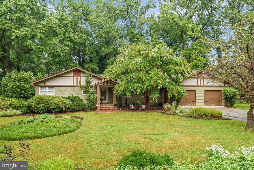 One level living in the land of pleasant living!  5 bedroom/4 bathroom home .4 miles from the beach in amenity filled Annapolis Roads. Combine all the ease and accessibility of a ranch with the charm and design of a craftsman and you'll get this incredible home on .7 acres of lovely landscaped land.  Not a detail was overlooked in creating this comfortable and flowing floor-plan.  Multiple living and dining spaces alongside numerous outdoor entertaining areas make this home fit for hosting or distancing.  Enjoy the custom fire pit set on the brick patio under the light strung pergola.  Or enjoy a glass of wine while relaxing in your hot tub overlooking the lush and private backyard.  Inside the kitchen is a chef's dream with a new 5 burner gas range and honed leather marble counter-tops.  Cozy up by the gas fireplace in the living room or grab a book from the book shelf lined dining room and take a seat in the light filled sun room.  Each bedroom not only offers space and storage but unique design and impeccable wood working details. The master bedroom is clad in board and batten, the sun room has wood siding walls and a wood plank ceiling, the living room has custom cabinet and shelf built-ins and even the stairwell leading to the lower level has rustic wood beams.  The lower level transforms you to a cozy pub in Europe with it's wood beams and stone walls.  Just an 8 minute walk brings you to the community beach, picnic areas and playground all with incredible views of the bay.  Further around the bend is a 2nd community waterfront access point with a dock and kayak racks for ultimate convenience.  Nature walks carve through Annapolis Roads and connect to the beautiful nature landscape and wildlife of the area. Come see and stay a lifetime!