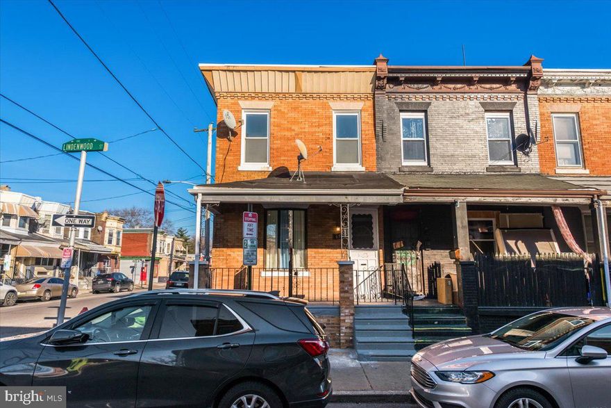 This end of row rowhome is cozy, clean, bright, and airy plus it's situated on a quiet street with plenty of street parking. Enter from the large covered front porch into the open concept main level. The living room, dining room, and kitchen all flow together so that everyone is always connected! There is decorative mantel, beautiful light fixtures, and there is new vinyl flooring. The new kitchen has a center island and stainless steel appliances. On the second level you will find the spacious primary bedroom plus two additional bedrooms. The updated full hall bathroom completes the second floor. The finished basement has another updated full bathroom and the laundry is tucked away nicely so it's not in the center of your living space. If that wasn't enough, this home is in a great location convenient to all types of public transportation, Center City, and Fairmount Park. There are also lots of restaurants and shopping close. Book your appointment before this one is gone!