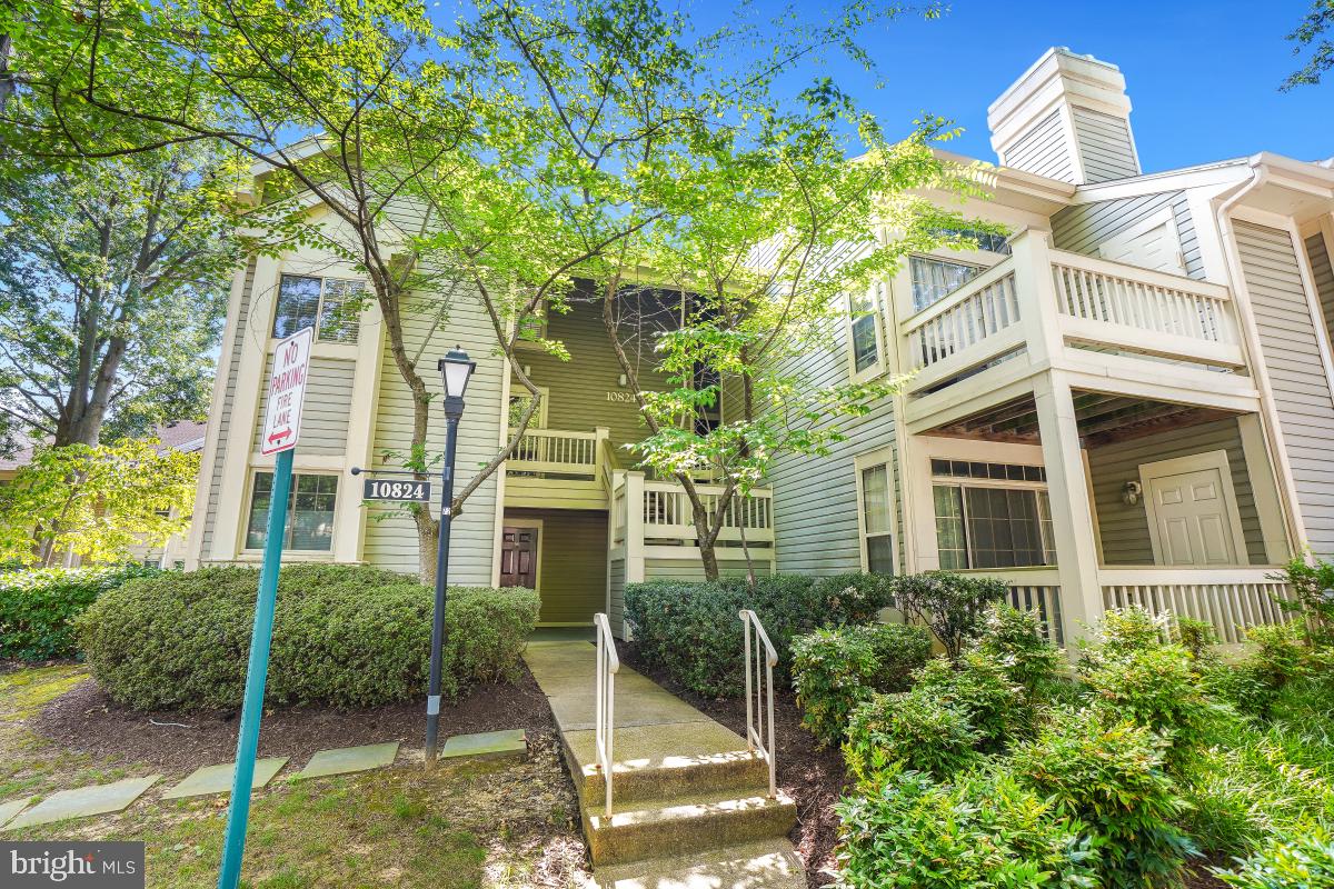 LOCATION, LOCATION, LOCATION! Sun-drenched and spacious, this 2 bed/2 bath condo is perfectly nestled in the highly sought-after Bentley Place community. The open floor plan features soaring cathedral ceilings, a generous kitchen with granite countertops and stainless steel appliances, and a dedicated dining area that flows into the inviting living room—complete with a cozy wood-burning fireplace and sliding glass doors that open to a serene balcony overlooking lush greenery and a picnic area. The main-level primary suite offers privacy and comfort with custom built-ins, ample closet space, and an en suite bath. Also on the main level: in-unit washer/dryer and plentiful storage. A spiral staircase leads to the versatile second-level loft bedroom—perfect as a guest room, home office, or gym. Upstairs you’ll also find a full bath, linen closet, and a large walk-in storage room. An assigned parking spot is conveniently located in front of the building and there is plenty of unassigned parking for guests. Bentley Place offers resort-style amenities including 3 pools, tennis & pickleball courts, basketball courts, tot lots, walking trails, picnic areas, and open sports fields. Unbeatable location—just minutes to Grosvenor Metro, Strathmore Music Center, Whole Foods, Wildwood Shopping Center, Pike & Rose, and easy access to I-270 and I-495. A must-see opportunity in an unbeatable location!
