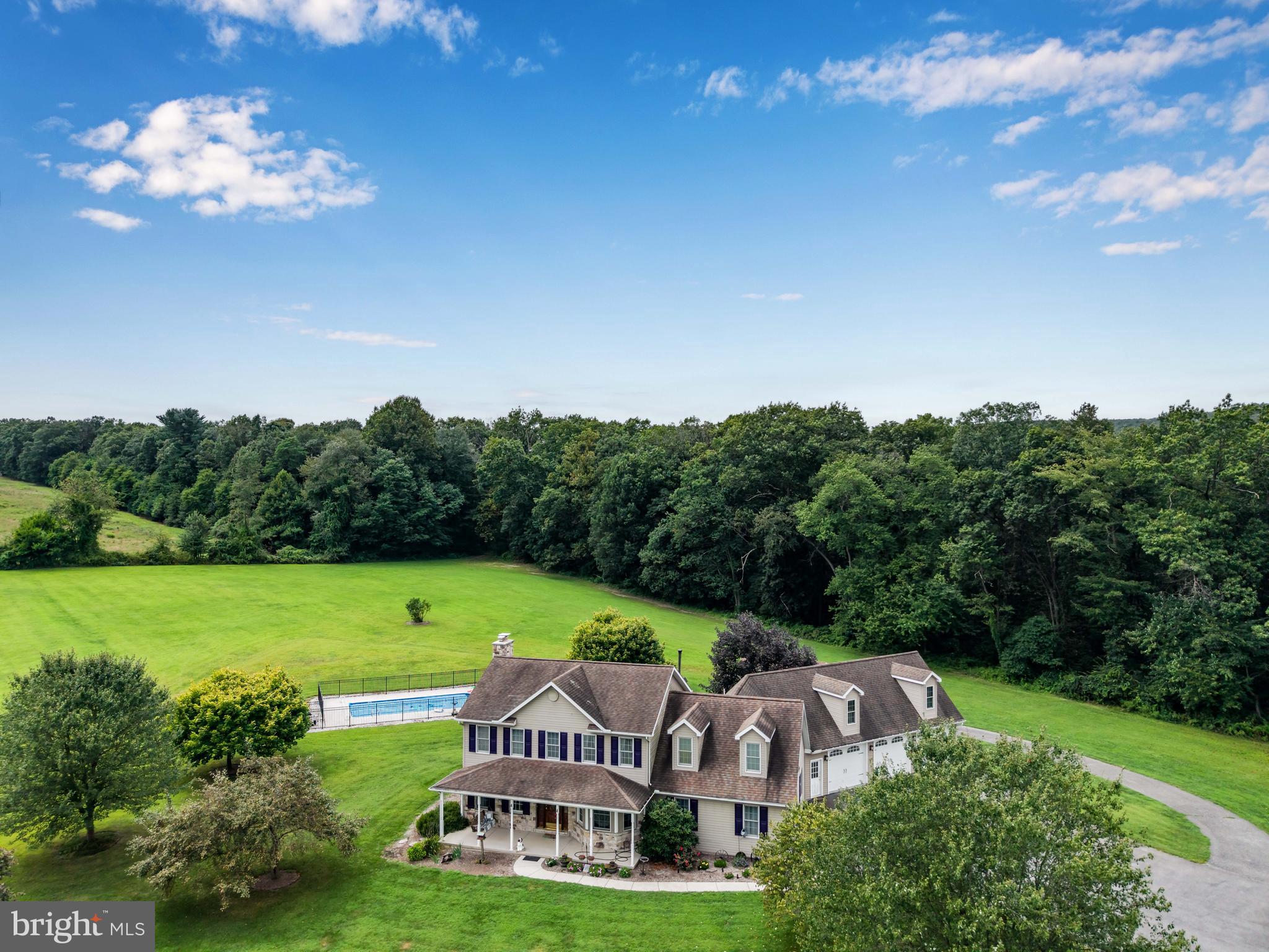 Seclusion at its finest!! Amazing Home. More amazing property!! There is so much information here, excuse me if it may seem a little scattered. You have 160 Acres +/- (2 parcels: 08-16-0210-005A and 08-15-0197-003). 15 acres open fields. 144 acres mountain land abutting Michaux State Forest. You have a home with primarily vinyl siding with stone fireplace and stone on the front of the home. The home was built in 1998. If you enter from the garage, you come into a mudroom with tons of closet space. You can move on into the kitchen or go left into a large office with ceramic tile and heated floor (or make it into a game room.) If you go into the kitchen, you have an eating area, a bar, and it's open through to the living room. (Appliances are stainless steel) The living room is carpeted and has a beautiful stone fireplace. There is an exit out onto a patio which will lead you to the inground pool. You move around the corner toward the front of the home and you have a half bath and on around to the formal dining room. If you keep going, you're back in the office/family room. Upstairs, you have a standard 4 bedroom, 2 bath main area, with a full owners suite. Through the 4th bedroom(could be a game room), you move on to additional rooms over the garage. These could be easily converted into a separate suite. There is a back set of stairs which lead to the garage which could be a private entrance. The laundry room is also in this area. The home has poured concrete basement walls which could easily be finished into more living space. There is a 3 car garage with heated floors. The swimming pool, garage floor , office floor and entire home are heated by the outdoor wood stove. There is also an oil hot air system that the owner does not typically use. 200 amp service, brand new 50 gallon water heater, plumbing for radon and sump pump and plenty of shelving round out the basement. Estimated $100,000 worth of standing timber. There are trails throughout the property. Deer are throughout the property and grow well because of the adjoining orchards. This is truly a paradise!! Properties are in Clean and Green for tax purposes.