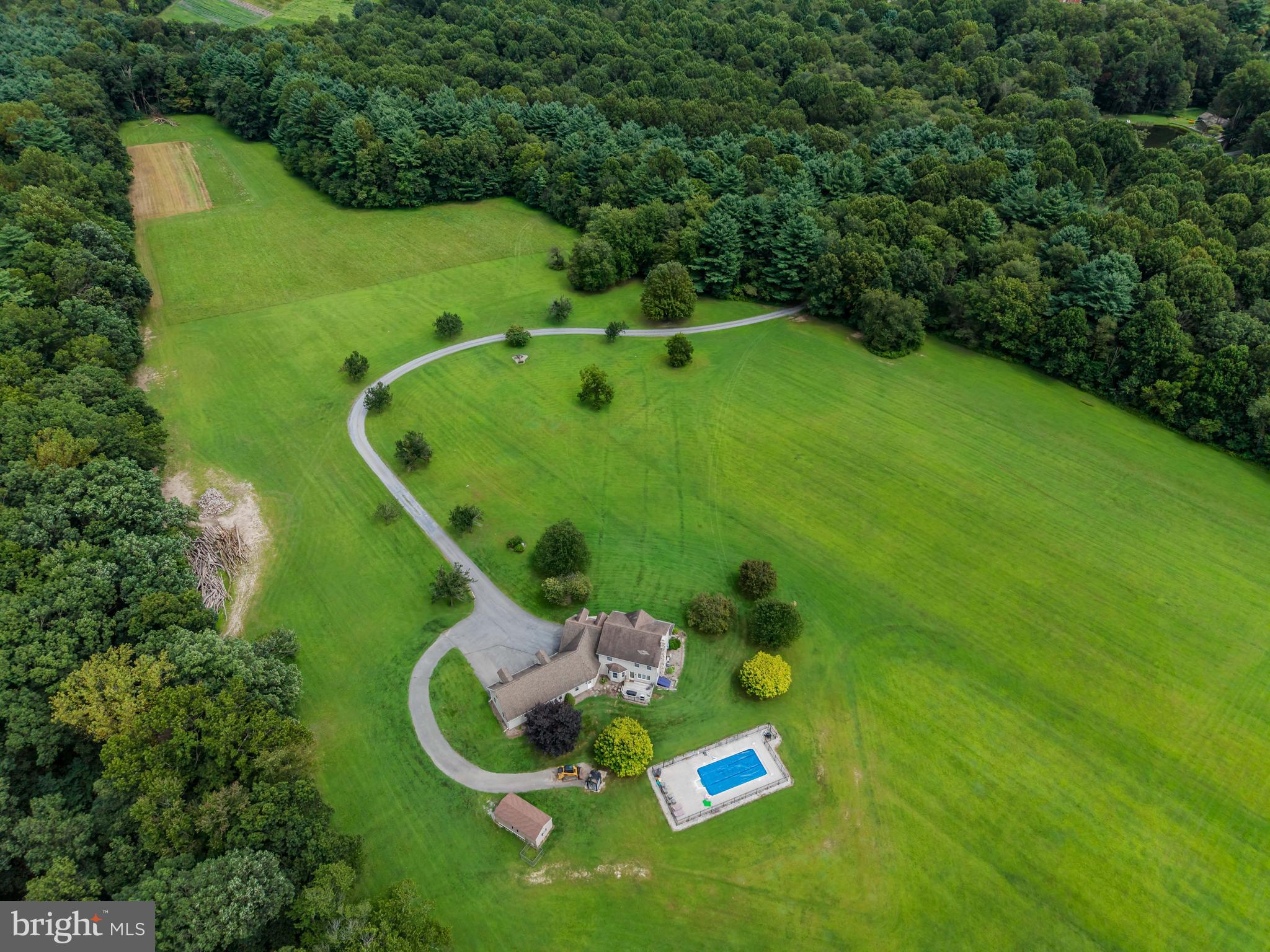 Seclusion at its finest!! Amazing Home. More amazing property!! There is so much information here, excuse me if it may seem a little scattered. You have 160 Acres +/- (2 parcels: 08-16-0210-005A and 08-15-0197-003). 15 acres open fields. 144 acres mountain land abutting Michaux State Forest. You have a home with primarily vinyl siding with stone fireplace and stone on the front of the home. The home was built in 1998. If you enter from the garage, you come into a mudroom with tons of closet space. You can move on into the kitchen or go left into a large office with ceramic tile and heated floor (or make it into a game room.) If you go into the kitchen, you have an eating area, a bar, and it's open through to the living room. (Appliances are stainless steel) The living room is carpeted and has a beautiful stone fireplace. There is an exit out onto a patio which will lead you to the inground pool. You move around the corner toward the front of the home and you have a half bath and on around to the formal dining room. If you keep going, you're back in the office/family room. Upstairs, you have a standard 4 bedroom, 2 bath main area, with a full owners suite. Through the 4th bedroom(could be a game room), you move on to additional rooms over the garage. These could be easily converted into a separate suite. There is a back set of stairs which lead to the garage which could be a private entrance. The laundry room is also in this area. The home has poured concrete basement walls which could easily be finished into more living space. There is a 3 car garage with heated floors. The swimming pool, garage floor , office floor and entire home are heated by the outdoor wood stove. There is also an oil hot air system that the owner does not typically use. 200 amp service, brand new 50 gallon water heater, plumbing for radon and sump pump and plenty of shelving round out the basement. Estimated $100,000 worth of standing timber. There are trails throughout the property. Deer are throughout the property and grow well because of the adjoining orchards. This is truly a paradise!! Properties are in Clean and Green for tax purposes.