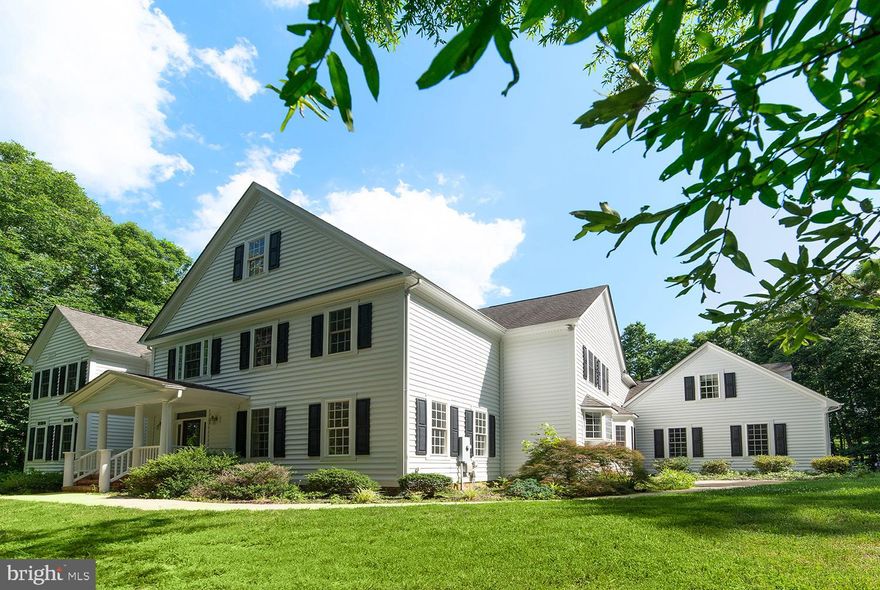 Over 7,000 sq ft of stunning estate, the perfect blend of elegance and country charm. Gorgeous interiors of gleaming custom wood floors and dramatic vaulted and coffered ceilings. First floor owner’s suite with fireplace in the bedroom and oversized bathroom with walk in closet, jacuzzi soaking tub, and separate shower. Four more bedrooms upstairs, each with its own individual bath. Expansive open space on the upper floor can be your dream home office, your hobby space, second family room or all of the above. Spacious kitchen with granite countertops and custom cabinetry. Full basement with finished and unfinished space and full bath. Private, wooded lot. Spacious open deck and screened porch leading to an inviting pool area surrounded by trees. Come see it now!