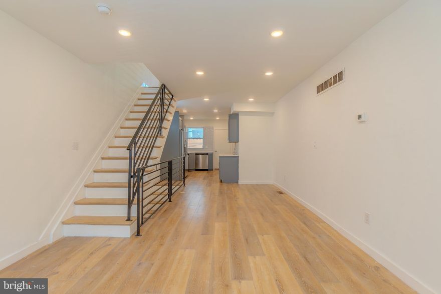 Fully remodeled in 2021, this thoughtfully updated home offers a stylish blend of modern finishes and practical comfort in every corner. From the moment you step inside, you're welcomed by durable and contemporary LVP flooring that flows throughout the main living spaces, setting the tone for a low-maintenance yet upscale lifestyle.

The kitchen is a standout, featuring striking marble countertops, a full four-piece stainless steel appliance set—all brand new—and ample cabinet space to meet your culinary needs. Whether you're hosting or preparing everyday meals, this space is as functional as it is beautiful. A convenient powder room on the main floor adds a thoughtful touch for guests.

Upstairs, enjoy dramatic 10+ ft ceilings that create an airy, open feel. Two generously sized bedrooms come complete with spacious closets, providing plenty of room to live and grow. The primary bath features a sleek double vanity and modern finishes, offering a spa-like experience right at home.

Downstairs, the fully finished basement expands your options—ideal for a home office, media room, gym, or bonus guest space. Stainless steel railings and other contemporary design elements continue the cohesive, elevated feel of the home.

Step outside to a fully fenced backyard, offering both privacy and plenty of room for entertaining, relaxing, or even gardening—an ideal retreat in the heart of the city.

With all-new appliances, updated systems, and modern touches throughout, this home is move-in ready and waiting for its next chapter. Don’t miss your opportunity to tour—schedule a showing today!