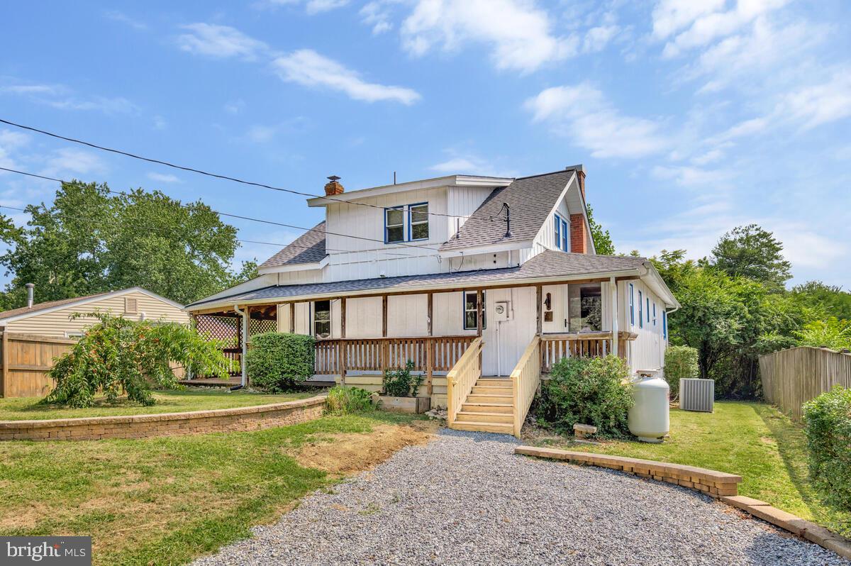 Charming Coastal Home Just Steps from the Chesapeake Bay!
This 3-bedroom, 2-bath home offers the perfect blend of coastal charm and modern convenience. Inside, you’ll find a bright dining area, a galley kitchen with updated cabinets and generous counter space, and a cozy living room that opens to a reading nook. There's also a main-level office and an enclosed porch with extra living space and a laundry area. One bedroom and a full bath are on the main level, while two additional bedrooms and a second full bath are upstairs. Both bathrooms have recent updates, and the home includes great storage with multiple closets and alcove spaces.
Step outside to enjoy a wrap-around deck with a partially covered section, a peach tree, and a new concrete back staircase and front steps. There's also a Level 2 EV car charging station for added convenience. A brand-new roof was installed in July 2025, and the home has been freshly painted throughout. There is a small garage parking space.
Located just a short walk from the Chesapeake Bay, this property includes access to a private, residents-only community beach—complete with grassy areas, a sandy shoreline, sunrise views, and leashed pets welcome. Neighborhood residents also enjoy free access to a nearby county park featuring a fishing pier, picnic areas, a playground, and a half-mile of beachfront. A voluntary community civic association ($55/year) provides a beach key and hosts events throughout the year. Don’t miss this opportunity to live the coastal lifestyle in a friendly, amenity-rich neighborhood!
Property is well maintained, new roof with transferable warranty and many upgrades, sold in as-is condition.