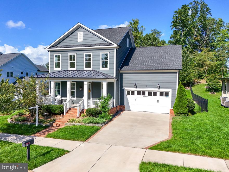 Introducing this meticulously maintained NV Homes Cape Charles, located in the coveted Fairways Overlook section of Potomac Shores with the LARGEST FRONTAGE LOTS in the community. This home offers over 5,300 sq. ft. of living space and backs to the 14th fairway of the Jack Nicklaus-designed Potomac Shores Golf Course. Inside, you'll find 5 bedrooms, with the option to add a legal 6th, 5 1/2 baths, and abundant storage. The main level boasts wide plank TRUE HARDWOOD flooring throughout, 10-foot ceilings, and an open-concept design. The gourmet kitchen features upgraded GE Monogram appliances, a large center island with breakfast bar seating, white shaker cabinets, above and below cabinet lighting, and a breakfast nook. The family room with a gas fireplace flows into the formal dining room, while the office with French doors and built-ins creates an ideal workspace. The main level also includes a bedroom with a full bath, ideal for guests. Step into the enclosed sunroom, complete with a doggy door leading to the custom Trex deck and professionally landscaped backyard that provides an AMAZING view! The fully fenced yard features a 6-zone sprinkler system, ensuring effortless maintenance and multiple gates for easy access. The expansive primary suite features hardwood floors, an exceptionally large walk-in closet, and a spa-like en-suite bathroom with a soaking tub, dual vanities, and a walk-in shower with 4 body jets. The upper level includes three additional spacious bedrooms—one with a private bath and two sharing a Jack and Jill bath—along with a laundry room with a utility sink and ample cabinetry. The lower level of this home offers a spacious finished recreation room with NEW carpet, perfect for entertaining or relaxing. A full bath adds convenience, while an unfinished room presents the opportunity to create a legal bedroom, adding significant value to the property. The expansive utility room provides versatility, offering plenty of space for storage, a workshop, or a home gym, making this lower level both functional and customizable to suit your needs. HOA fees INCLUDES high-speed internet, trash, and access to world-class amenities, including fitness facilities, the Jack Nicklaus Signature Public Golf Course, Tidewater Grill, pools, courts, and over 9 miles of trails. The vibrant community offers numerous activities, including book clubs, a garden club, and more. Covington-Harper Elementary, Potomac Shores Middle, John Paul The Great High School, and the Ali Krieger Sports Complex are all conveniently located within the community. Future plans include a VRE station and Town Center. Don’t miss the chance to make this your dream home in Potomac Shores!