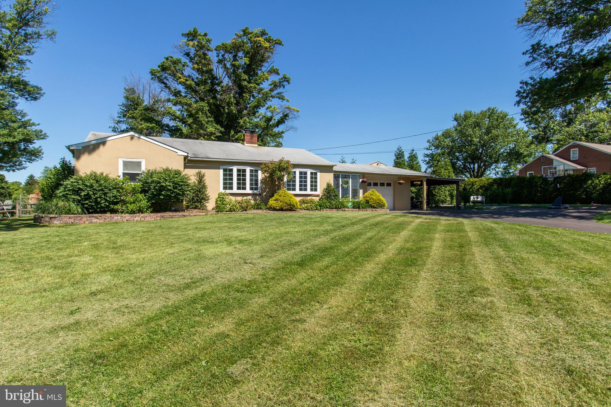 Come see this charming upgraded 2 bed, 1.5 bath ranch complete with a partially finished basement and lots of potential. This home is situated on nearly an acre of land on a peaceful road in Towamencin Township conveniently located to all amenities! Passing the 1 car carport and 1 car garage, you will be entering this cute ranch through the enclosed porch and see the quaint living room with its wood fireplace insert, perfect for cold months. Going through the dining room and newer kitchen with plenty of sunlight, you will exit to the outside yard. A 1,000 sq ft rinox block paver patio, double face retaining wall & 4 piers along with 500 ft split rail fence will greet you, perfect for enjoying during the warm months. Going back inside, the charming ranch is completed with 2 generous sized bedrooms with a full bath. The partially finished basement has tons of potential with a half bath, laundry area, cedar closet and plenty of storage. This home is perfect for first time homebuyers or anyone downsizing. Come see this little gem at the open house this Sunday 1-3pm!