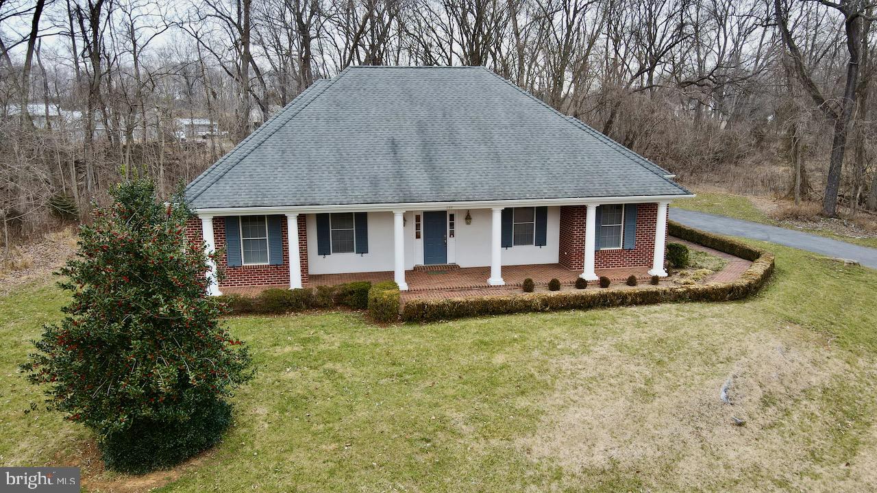 One level living in the sought after area of Fernbank at Cress Creek! This beautiful brick home was custom built with features such as 2x6 construction, insulated walls, and an open layout. Enter from the brick Front Porch into the Foyer which opens up to the Family Room with stone wood burning fireplace and Dining Room area, all with hardwood flooring. From the Family Room enter the Kitchen and Breakfast rooms which include appliances such as a built-in microwave and large walk in pantry. Laundry Room is located just off the kitchen with utility tub. Beautiful Italian Tile flooring runs through the Kitchen, Breakfast Room, and Laundry. The Primary Owner's Suite has a large sitting room with separate closet which could be used as a private office as well as an attached Luxury Bath with double sinks, tile flooring, soaking tub with whirlpool jets and a roll in shower made easy for handicap accessibility. 2 Junior Bedrooms share a large full bath. Finished Bonus Room above the garage could easily be a 4th bedroom, home office, or craft room. Relax on the Brick front porch or the rear screened in patio which backs to trees for added privacy. Plenty of parking on the long driveway and 2 car side load garage. Fernbank is connected to the Private Cress Creek Golf Course which offers memberships from Social to Full Social and Golf Privileges'. They have tennis courts and a swimming pool. Minutes outside of the quaint town of Shepherdstown with tons of shopping, fine dining and home to Shepherd University. **Sellers also own the adjoining lot which is about 2/3 acre and will be available for purchase to extend the already existing half acre which the homes rests on or is set up for a second home to be built. Inquire for further details.