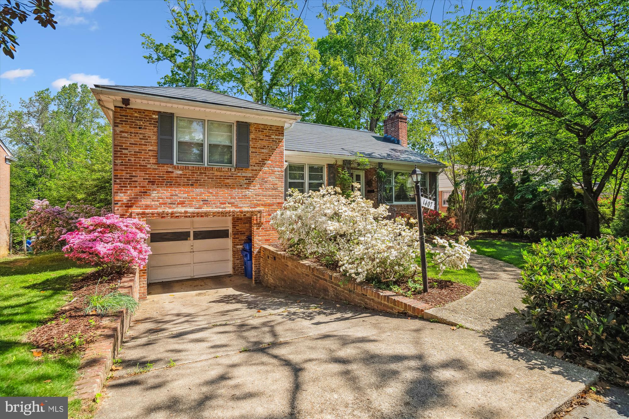 Welcome to this beautifully updated split-level home in the heart of Woodside Forest—where classic curb appeal meets modern convenience. Thoughtfully expanded and upgraded, this home offers flexible living across four finished levels, along with features rarely found in the neighborhood.
The main level includes a generous living room, a spacious dining area, and an updated kitchen—all flowing into a fully enclosed sunroom, perfect for year-round relaxation, morning coffee, or entertaining with a view of the garden.
Upstairs are three large bedrooms, including a peaceful primary suite, plus a full hall bath with charming original tilework. Hardwood floors run throughout, with new carpet in the finished attic and basement for added comfort.
The finished attic provides a flexible bonus space—ideal for a home office, creative studio, or guest bedroom. On the lower level, enjoy a cozy family room, an additional bedroom with fireplace, a custom-built sauna, and a fully equipped home gym featuring a Peloton bike, rowing machine, and interactive fitness mirror—all of which convey.
Outside, the beautifully landscaped front and rear gardens offer a peaceful setting for entertaining or relaxing. A two-car garage, whole-house generator, and electric vehicle charging station add rare and valuable convenience.
Sustainable living is at the forefront with a full Tesla solar roof system that dramatically reduces energy costs while supporting a greener lifestyle.
All just minutes from Sligo Creek trails, downtown Silver Spring, Metro, parks, dining, and more.