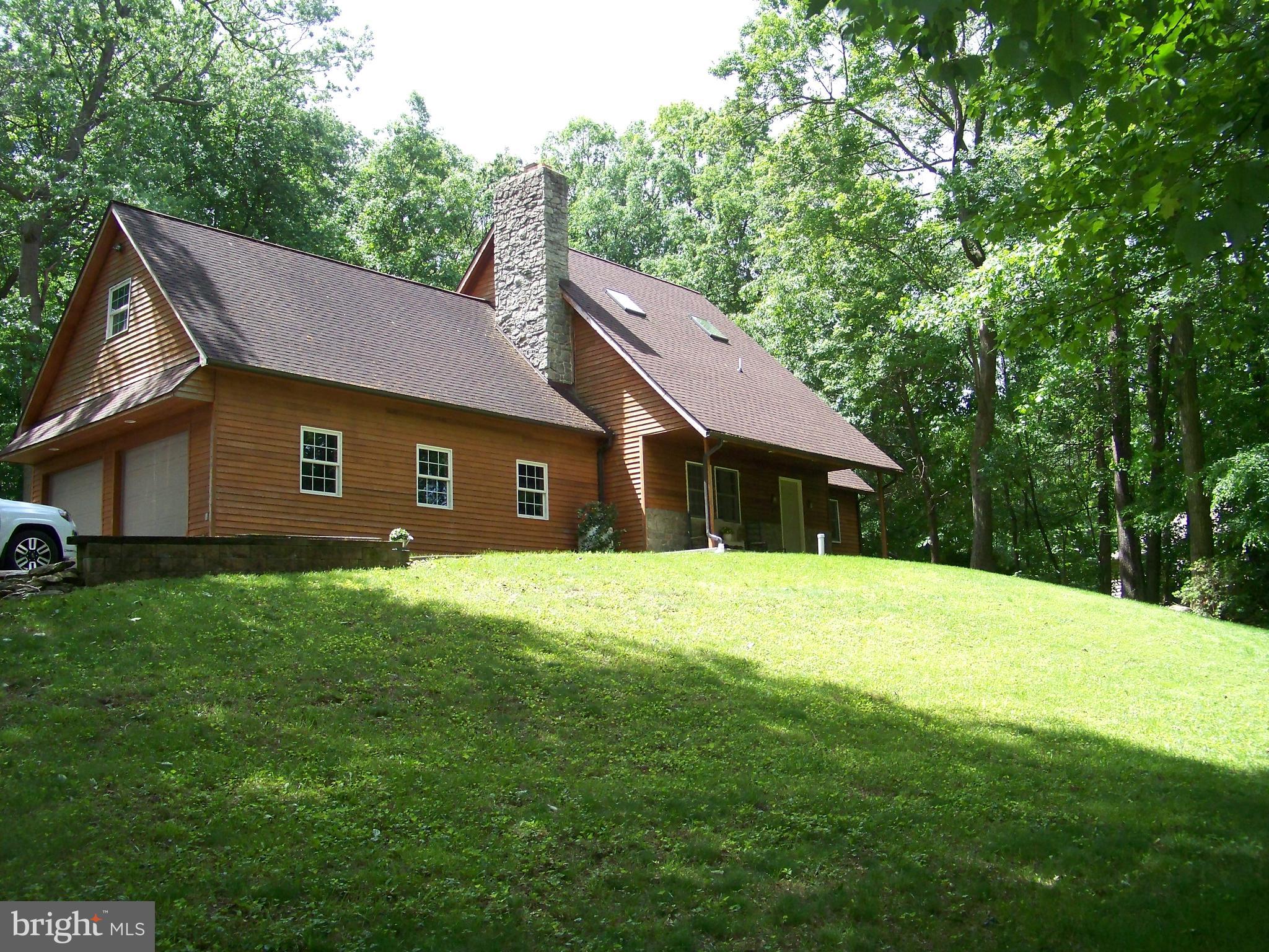 Secluded Custom Cedar Siding Home
Tucked away in the peaceful countryside of Bart Township, this 1,936 sq ft custom built home offers the perfect blend of privacy, character, and craftsmanship. Built in 1990, this 1.5 story home features 3 bedrooms, 2.5 bathrooms and a striking vaulted ceiling with exposed wood beams that highlight this charming home.
Natural light pours in through four skylights, while a beautiful stone fireplace serves as a cozy focal point in the spacious living area. Enjoy quiet mornings on the front porch or entertain on the large stamped concrete patio outback surrounded by nature.
Additional highlights include an oversized two car garage and a location in Solanco school district. Located in scenic Lancaster County, this home is ideal for those seeking comfort, space, and seclusion!