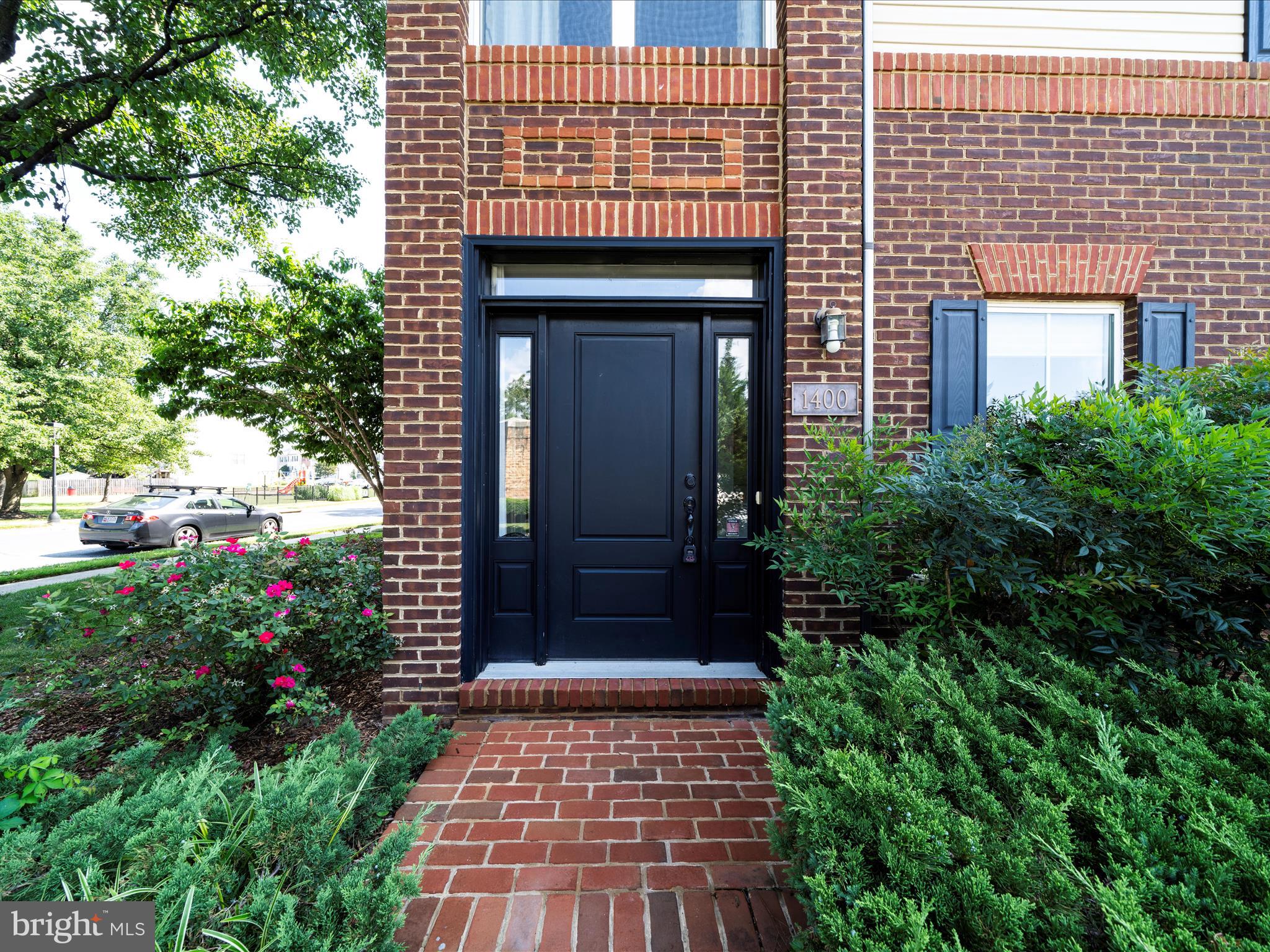 Welcome to your new home! This stunning 4-level end-unit townhome—formerly a model home—offers exceptional upgrades and stylish design throughout. Exposed brick walls and gleaming hardwood floors add warmth and character to the living spaces. The spacious owner's suite includes a relaxing sitting area and a luxurious en-suite bath, featuring a spa shower with built-in seat, jetted soaking tub, ceramic tile flooring, and a double-sink vanity. Enjoy the top-level loft—perfect for entertaining or unwinding—with its own wet bar, skylight, and access to a private outdoor terrace. An additional bedroom and full bath on this level provide extra privacy and flexibility. The gourmet kitchen is a chef’s dream, boasting granite countertops, 42" cabinetry, an island with seating, double pantry, stainless steel appliances, and a 5-burner gas cooktop. Ideally located near Wegmans, Lowe’s, popular restaurants, urgent care, gas stations, and major commuter routes—this home has it all. Don't miss your chance to see it—schedule a tour today!