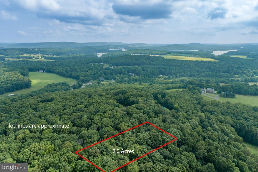 Two  acre wooded parcel with utilities to site. This level lot in a private setting and conveniently located yearns for your vacation or full-time residence home plans! No thru street in a lake area community with easy access for all things fun in Garrett County and Deep Creek Lake. Currently updating perc.