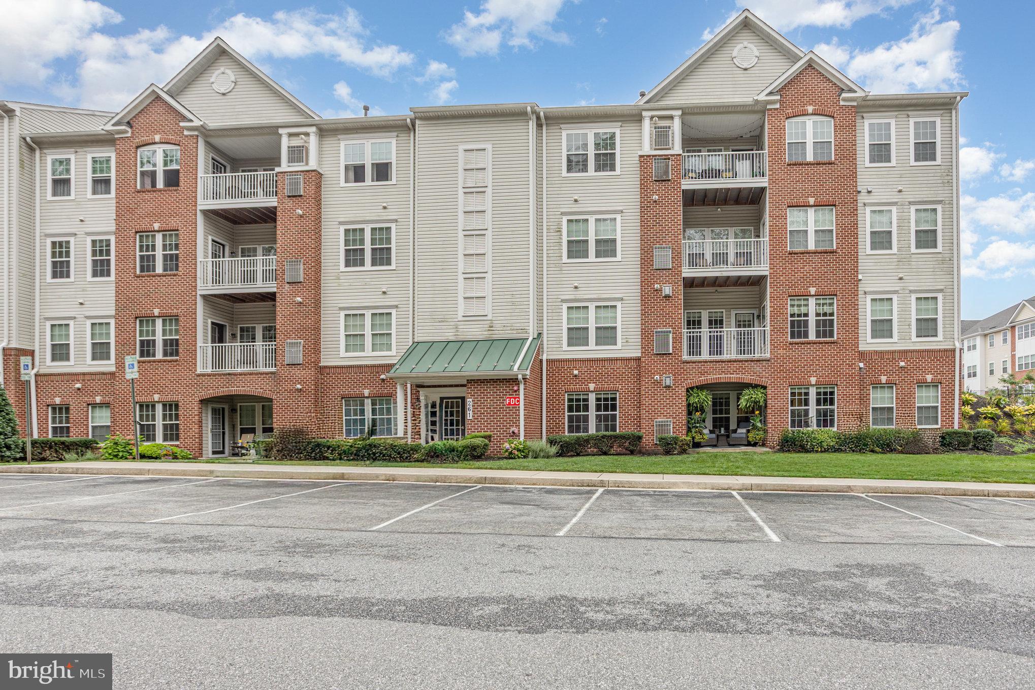 Welcome home to the Legacy at Gateway 55+ Community! Tucked back conveniently at the end of Gateway Drive in downtown Bel Air, this building has multiple views of the woods of the MA & PA Trail and if you're looking to see what's going on in the community you can easily catch a glimpse of the rest of your community. This 2nd floor condo is uniquely positioned as you not only have elevator access, but you can choose to enter directly onto the floor of your unit from the Gateway Drive side of your building to avoid stairs and the elevator!
Upon entering the condo, you'll find you have a spacious coat closet with additional shelving for maximum use and also a generously sized storage room. The family room has a gorgeous gas fireplace with granite surround and even custom built in shelving that's meant to hide all the wiring from your electronics. The original owner chose to place the balcony door with convenient access from the family room, leaving extra windows with natural light in the Sunroom. The balcony with composite decking has great views of the woods and trail! The dining room is off the family room and is complete with gorgeous chair rail! The kitchen has stainless steel appliances, Corian counters, a pantry and even has a breakfast bar that overlooks the family room so you can be present for all of your gatherings! The primary bedroom has a walk-in closet, another separate spacious closet and also a linen closet in the primary bathroom that even includes a double vanity and easily accessible shower with grab bars. The second bedroom is perfect for your guests or an office and the second bathroom is located right off the foyer and family room, so you can keep your Primary Ensuite private.
Roof recently replaced, 2018 water heater, furnace regularly serviced, new toilets, 2022 washer, air & dryer ducts cleaned in May. Don't miss out on calling the Legacy at Gateway your home!