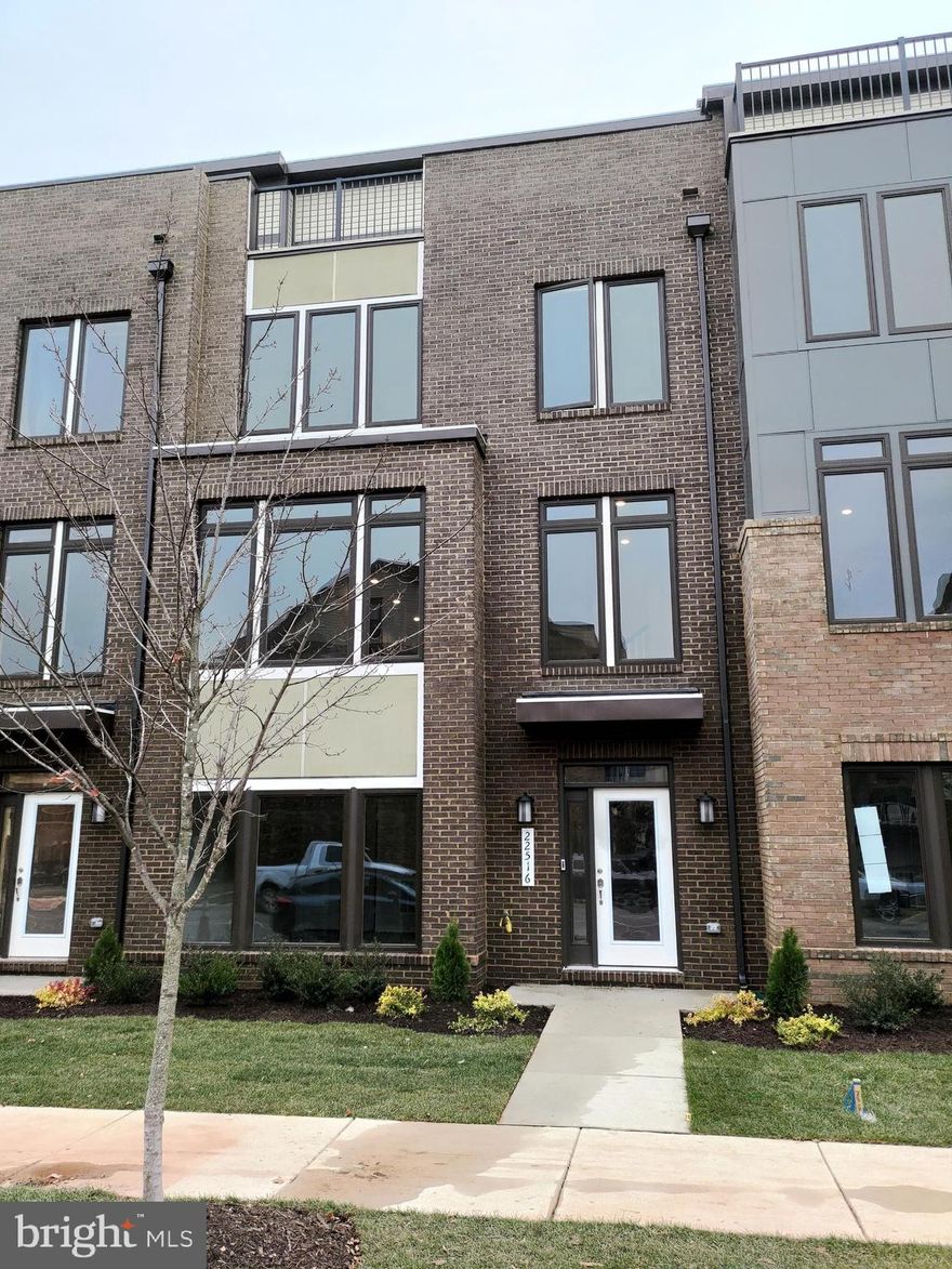 Location!!! Brand New!!! Emerson II Floor plan in Metro Walk Community.   3251 sq. ft.      4-level townhome with 4 Bedroom and 3 Full Baths & 2 Half Baths. Lower Level Attached to a Huge 2 Car Garage Features with Den with Tall Windows & a Half Bath. Main Level Kitchen w/upgraded cabinets Featuring Stainless steel Appliances with a Stove/Range, Built in Microwave & a 3 Door Refrigerator completed with a tile backsplash along with a Large Central Island housing the Sink & the Dishwasher. Family Area with Fireplace, Large Dining Area, and 5x22 deck.  Upper 1 Level Features 3 Bedrooms & 2 Full Baths & a Convenient Laundry Room, Upper 2 has a Large Open Loft with Terrace, Bedroom & a Full bath, Home includes an awesome technology package