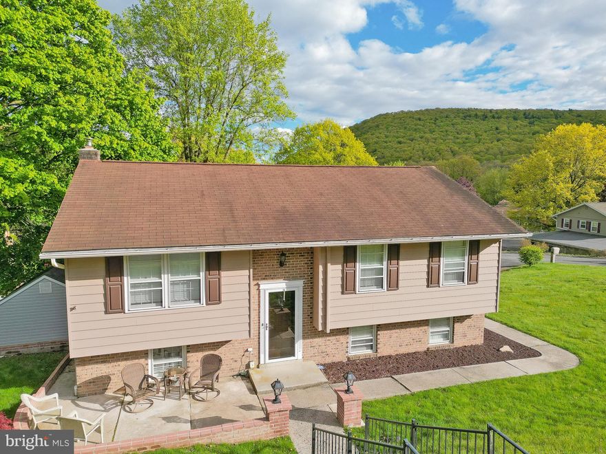 Multiple Offers Rec. Highest and Best 5/12 @ 6 PM.  Situated in the charming Forest Hills neighborhood of Pottsville, this classic bi-level offers ample space and lovely touches throughout. The entry boasts a full height stone accent wall and leads to the bright and open upper level offering a spacious living room, eat-in kitchen, as well as a full bath and two spacious beds, the larger offering tremendous space and two closets. The lower level presents a sprawling family room with wood-burning fireplace, a laundry/half bath, mud room, and third spacious bedroom. The lower level offers two access points to the home’s rear, concrete patio with ample space for entertaining. The front and side yards present with thoughtful landscaping and a lovely hardscape patio to the home’s front. A large rear shed is ideal storage for your outdoor tools! Mini-split units throughout the home keep it climate comfortable throughout all four seasons! This house is a ready canvas for you to paint it home.