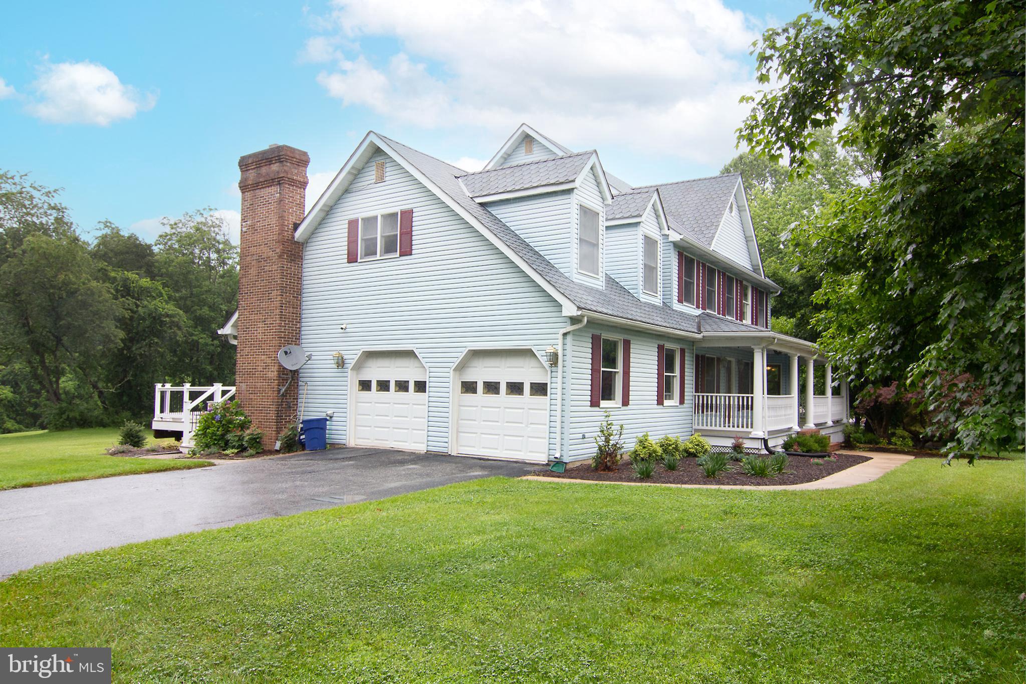 This spacious four-bedroom, two full and two half-bath colonial is ideally located in the highly sought-after Reservoir Ridge neighborhood, nestled on a stunning four-acre lot bordering Liberty Reservoir Watershed Property. Enjoy access to miles of fire trails for horse back riding, hiking and wildlife sightings. Deer, bald eagles, and wild turkeys, can all be observed while relaxing on your deck, wrap-around porch, or screened-in porch. Recent updates include new carpeting, luxury vinyl flooring, refinished hardwoods, and fresh paint throughout. The two-car side-entry garage features built-in tool and storage cabinets. The main level offers an open floor plan with a family room, dinette, and kitchen. The family room includes a gas fireplace with built-in shelving, a 60-inch ceiling fan, and double doors leading to the expansive, low-maintenance deck. The kitchen is equipped with new stainless steel appliances and is ready for your personal touch. The main level also has a half bath, formal dining and living rooms with a wood-burning fireplace, and an office with built-in shelving. Upstairs, the primary suite includes a remodeled on-suite with a walk-in shower, soaking tub, and double vanity, as well as a dressing room. Three additional bedrooms and a second full bath complete the upper level. The expansive lower level offers ample space for a recreation room or pool table, with vinyl plank flooring, recessed lighting, and a walkout slider to a recently landscaped yard. A fully renovated half bath and rough-ins for a wet bar and gas fireplace are also included.
Additional features include a new HVAC system, a 20-foot by 40-foot parking pad perfect for an RV, boat, or trailer, and proximity to Liberty Reservoir Boat Launch, Eldersburg, and M&T Stadium. Don't miss the chance to see this unique property. Home inspection available upon request.