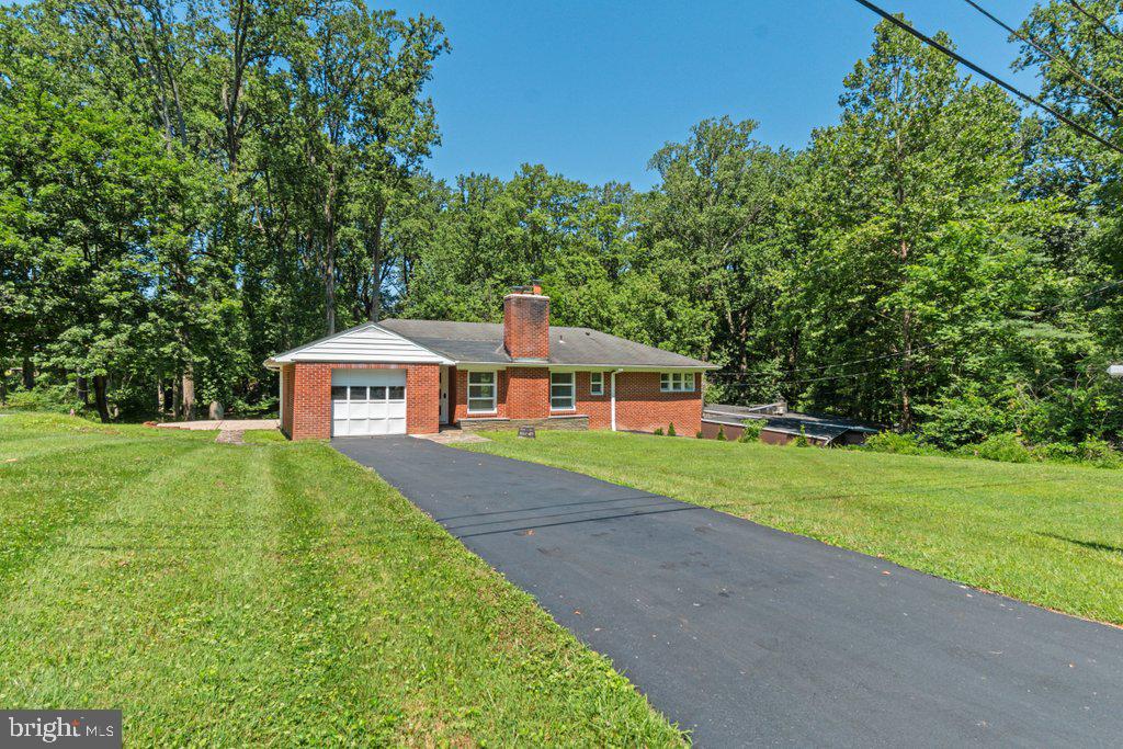 Loch Raven reservoir is 20 minutes through the woods across the street. This single-family home is nestled back in a quiet established neighborhood which boasts limited traffic, single-family homes, and a nature lover’s paradise less than two miles from the beltway. Close to Notre Dame Prep, Concordia Prep, and Calvert Hall. This newly renovated home was upgraded in April with new carpet, tile, and freshly painted interior. Step inside to discover solid oak wood floors, all new appliances, and an abundance of natural light flooding through the picture windows, framing serene views of your .50-acre lot. Electric and plumbing have been upgraded and inspected. Enjoy pure, clean water with no added chemicals from your own private robust well. The finished carpeted basement offers a large recreation room with a 4th bedroom, 2nd full bath, full laundry room, and plenty of storage space. Outside, the vast lot offers endless possibilities for outdoor activities, gardening, or simply unwinding in nature's embrace. The charmingly landscaped lot backs to trees and features a large patio. Imagine enjoying morning coffee on your patio or hosting gatherings enjoying the backyard vista, all while relishing the peaceful surroundings with little traffic and significant privacy. Don't miss the opportunity to make this lovely property your own and experience the ultimate in family living combined with natural beauty.