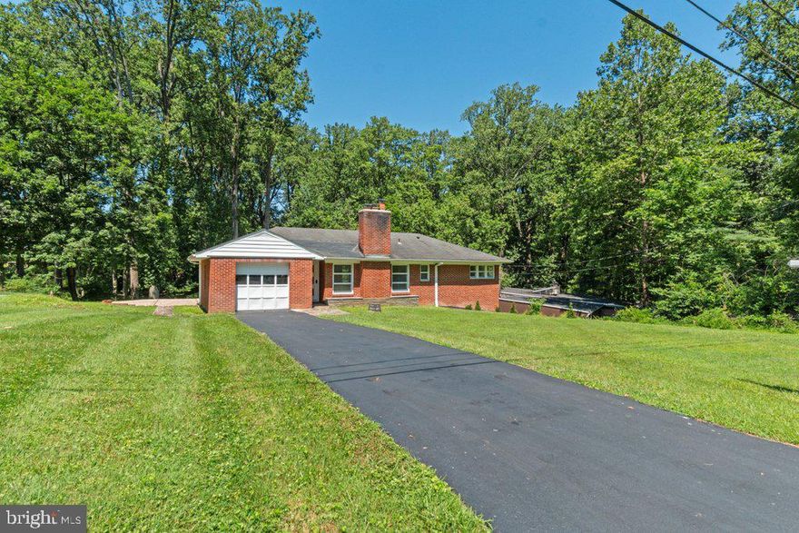 Tucked away at the end of a quiet u-shaped road off Providence Road, this beautifully renovated single-family home offers the perfect blend of comfort, privacy, and nature—just two miles from the Beltway and four miles from Towson. Located in a peaceful, well-established neighborhood with limited traffic and surrounded by lush greenery, the property is a nature lover’s dream. Step across the street to access 17 acres of private conservation land, offering direct wooded trails to the stunning shores of Loch Raven Reservoir, only a 20-minute walk away.

Inside, you'll find quality craftsmanship and thoughtful upgrades throughout. Solid oak hardwood floors, large picture windows, and a fresh interior painted with high-end Benjamin Moore white create a bright and welcoming atmosphere. The home boasts all-new appliances, premium tile flooring (PEI 5 hardness), and spa-like bathrooms featuring Grohe rain shower heads, handheld sprayers, and elegant finishes. The main level is fitted with new Lifeproof premium nylon carpet (not polyester) with thick half-inch padding for exceptional comfort.

The fully finished basement adds incredible versatility with a large recreation area, fourth bedroom, second full bath, full laundry room, and generous storage. Comfort and functionality continue with a real wood-burning fireplace, new double-wall Roth oil tank system with updated copper feeds and safety alarms, a freshly sealed driveway, and restored slate walkways. A new emergency exterior shutoff box has also been installed to meet current Baltimore County code.

Major systems have been significantly upgraded, including a new 200-amp electrical panel, a 125-amp subpanel for the kitchen and laundry, brand-new switches, outlets, dimmers, and lighting throughout—all professionally grounded and inspected. The central air units have been serviced with new components, and a new fresh air intake improves furnace efficiency. Two extra thermostat zones are already plumbed for any future expansions.

Step outside to your private half-acre lot, where mature trees frame a spacious yard and beautifully updated patio—perfect for relaxing, gardening, or entertaining. A new sidewalk and patio dividers, plus a PVC underground gutter system, help maintain the property and protect the foundation. The home is served by a private well, delivering clean, chemical-free water straight to your taps.

Additional touches include chrome fixtures from the Pismo Collection, solid brass cabinet hardware, a brand-new tri-panel front door with a glowing blue doorbell, and soundproofing between the main bath and living areas for added peace and privacy. This home is move-in ready and located minutes from top-rated schools including Notre Dame Prep, Concordia Prep, and Calvert Hall.

Enjoy a tranquil lifestyle surrounded by nature without sacrificing access to city amenities—your peaceful, private retreat awaits.