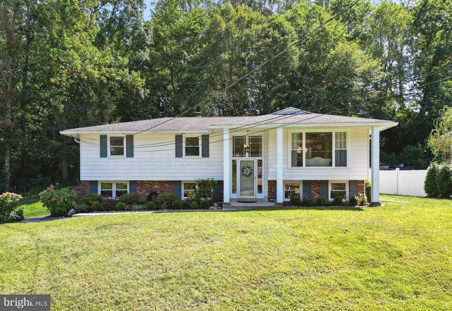 Welcome Home to this Move-In Ready Bi-Level Gem in Broomall! Nestled on a picturesque Corner Lot at the end of a quiet Cul-de-sac, this beautifully Upgraded 4-bedroom, 2-bath home is located in one of Broomall’s most sought-after neighborhoods within the highly rated Marple Newtown School District. As you approach the home, you’ll walk up meticulously landscaped front garden beds, bursting with seasonal color and curb appeal that welcomes you in with warmth and style. Step through the front entrance and be greeted by gorgeous slate tile flooring and updated lighting. The main level features a Bright and Spacious Open-Concept layout, showcasing refinished hardwood floors, tasteful neutral finishes, and an abundance of natural light streaming through the Newer Picture Windows (2023). At the Heart of the Home is the stunning, fully Updated Kitchen—complete with granite countertops, tile backsplash and flooring, stainless steel appliances, a large breakfast island with pendant lights, and sliding doors leading to the BRAND NEW Trex deck (2025). Whether you’re hosting guests or enjoying a quiet night in, the seamless flow between the kitchen, dining, and living areas makes this home perfect for both Entertaining and Everyday Living. Enjoy peaceful views of the serene, tree-lined backyard from the rear deck or paver patio, ideal for outdoor gatherings or quiet relaxation. The dining area is both functional and stylish, complete with built-in cabinets that offer extra storage—perfect for displaying serveware, storing linens, or keeping everyday essentials organized. Down the hallway, you’ll find Three generously sized Bedrooms, each with hardwood flooring, ample closet space, and ceiling fans, along with a beautifully Updated Full hallway Bath. The lower level offers even more Living Space, featuring a Fourth bedroom, another Updated Full Bath (2023), a Large family room, and a laundry/utility area—all conveniently accessible from a ground-level side entrance and connected to the Attached Garage. Located just minutes from local parks, schools, shopping, and popular dining spots like Ellis Preserve and Lawrence Park, with easy access to Routes 3, 476, 202, and public transportation—this home truly has it all.