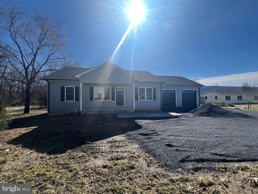 Brand new beautiful ranch home with oversized garage. Laminate flooring throughout. Tiled master bath shower. Separate laundry room with laundry sink. Large rear deck with lots of privacy. Refrigerator, range, microwave and dishwasher included. Lots of closet space with spacious master bedroom closet.