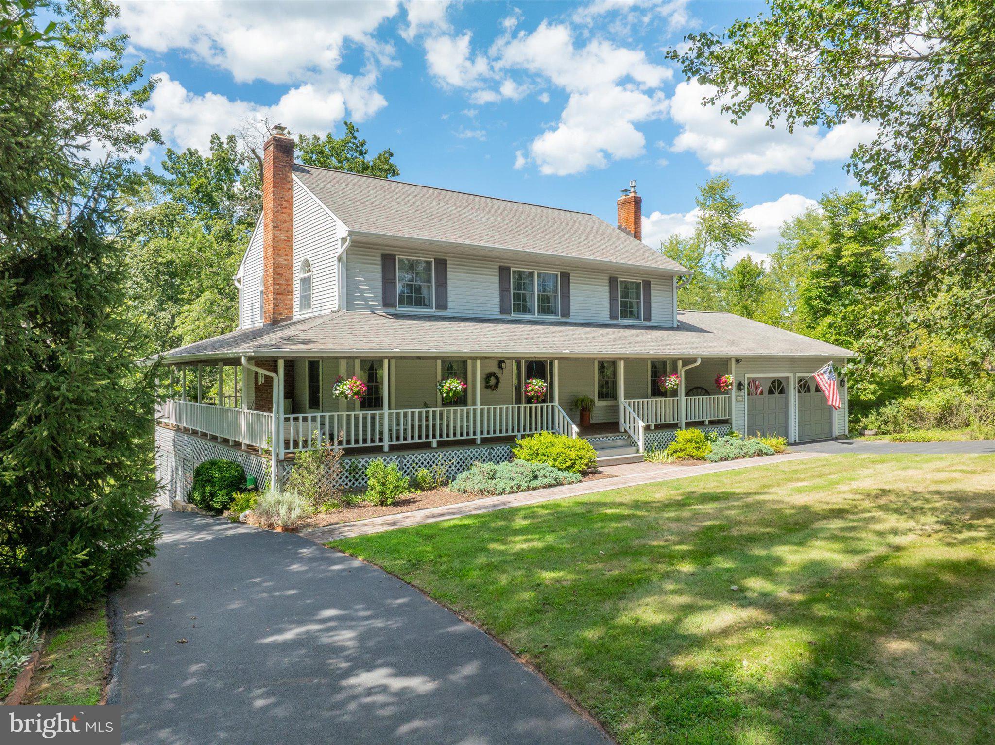 Welcome home to this truly remarkable custom home located in the prestigious Whispering Woods quarter of Worcester Township. Situated on a little under an acre and a half, this property provides superb land and location with a high level of privacy and tranquility. Upon arriving you are welcomed by a large wraparound mahogany decked covered porch. This property even offers 2 separate driveways and 3 garage door spaces
with lots of storage. With 4 bedrooms, 2.5 bathrooms and the attic and basement as bonus rooms, this house boasts ample space and a thoughtfully designed floor plan. Walking inside, you have a comfortable and well-lit living room with French doors that offer a stunning view of the backyard. The living room also includes a catalytic wood burning fireplace insert. The home has a large combination kitchen with a propane stove. Additionally, the first floor even has a bonus multipurpose room. The second-floor houses 4 bedrooms and easy access to the finished attic that was used as an office. The custom millwork, arched windows, beautiful trim work, beautiful random width hardwood floors on first and second floor and many other details around the home really show the attention to detail and care that went into the design. Lastly, the backyard is truly special and inviting with trees on all sides and so much space to customize and use as you please. Opportunities like this are rare, and this home is ready for its new owners to take loving care of it just like it has been lovingly maintained for the last 40 years. Perhaps this is the perfect home for you. Arrange your tour today!
