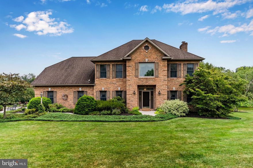 Welcome to this beautifully situated stately brick home on a tree-lined cul-de-sac lot! This stunning residence features a screened-in porch that overlooks an inground heated pool, surrounded by extensive landscaping, perfect for summer evenings spent watching TV and enjoying the gorgeous outdoor setting. Step inside to discover a naturally bright kitchen, highlighted by a picture window that showcases views of the landscaped pool. The family room boasts a classic brick gas fireplace, with windows flanked on both sides, allowing for an inviting atmosphere. The dining room features elegant hardwood flooring, making it an ideal space for entertaining. The generously sized primary bedroom suite includes 2 walk-in closet's and a luxurious primary bathroom equipped with a tiled walk-in shower, soaking tub, and double sinks. This home also offers a finished lower level complete with an in-home gym, media room, bar area, and plenty of room for entertaining friends and family. Enjoy the privacy of a fenced-in backyard that backs up to trees, providing a serene retreat. Located in the heart of Hampden Township, this home is just a short walk to the new Township Park. Don’t miss the opportunity to make this home your own!