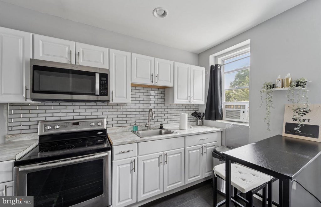 Photo of 7018 Woodland Avenue, PHILADELPHIA, PA 19142 (MLS # PAPH2660398)