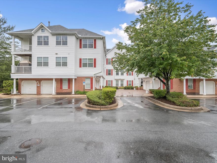 **Offer Deadline: Tuesday, June 3rd at 8:00PM**
Welcome to this ground level two bedroom, two bathroom condo in the desirable Hollington at the Pointe community. A private garage with an interior ramp provides easy entry into this spacious first-floor unit. The open concept layout connects the living and dining areas, highlighted by sliding glass doors that lead to a private patio. An eat-in kitchen features a new gas range and refrigerator (both replaced last year), along with a breakfast nook, pantry and a laundry closet. The primary bedroom boasts two closets and an ensuite bathroom with a dual vanity, walk-in shower, and soaking tub. The second bedroom is adjacent to the second bathroom that has a tub shower. Completing this home is a versatile den that offers additional space for a home office, workout room, lounge, or even a potential third bedroom. Recent upgrades include a new HVAC system (2024) and water heater (2023). Enjoy the wonderful community amenities, including the New Town outdoor pool, tennis courts, and playground. Central Park has a walking trail, community garden, and dog park, while nearby Red Run Stream Valley Trail invites further outdoor adventure. Excellent location close to everything you need with an abundance of shopping, dining and other essentials just minutes away, with quick access to Owings Mills Blvd, Red Run Blvd, I-795 and the Owings Mills Metro Centre. Some images have been virtually staged.