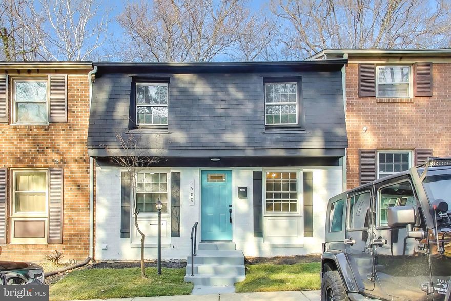 Beautifully renovated Colonial townhouse updated in 2025, offering modern comfort and timeless charm in a quiet, established community. Open-concept living area features a modern electric fireplace and includes a newly installed 75-inch LED TV for added comfort and convenience. Finished basement provides flexible space for a home office, media room, or recreation area. Classic brick exterior, updated finishes throughout, and thoughtful details enhance everyday living. Enjoy outdoor space on a 0.12-acre lot and access to a community pool. Built in 1973 and thoughtfully refreshed—move-in ready and ideally located.