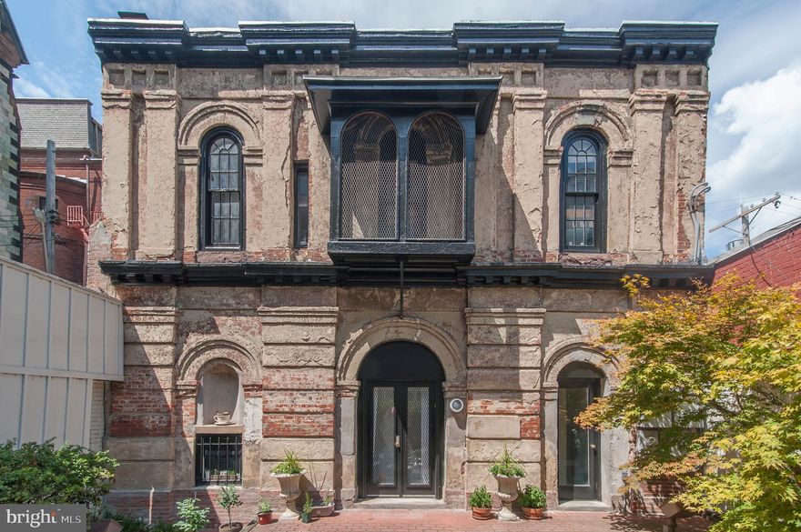 Artist Masterpiece! All Furnishings Negotiable. You will Love this Completely Renovated  Condo in Heart of Mt. Vernon - Baltimore's Historic and Cultural Center. This Home is an Artist's Dream. The Carriage house this condo is inside was built in 1870. Every Room has Unique Features and Repurposed or Refinished Historical Touches. From the Fully Renovated Kitchen to the Historic Family Room Fireplace, this Home has Everything.  The Foyer Features Ample Storage, Inviting Bright Colors, and an Original Marble Floor that has been Refinished with a Blue Resin Giving the Entire area a Chic Feel. There is a Convenient Main Floor Bedroom with Huge Windows for Maximum Natural Light and High 9ft Ceilings and an adjacent Full Bath with Original Charming Floor Tiling. The Second Floor has the Perfect Open Concept Entertaining Space that starts with a Gorgeous Gourmet Kitchen and it's Massive Granite Peninsula, Specialty Cabinetry, Breakfast Nook, and 8 ft of Windows stretching to the Skylights. The Open Family Room Boasts a Redesigned Fireplace as a Focal Point of the Cozy Space and a Barn Door to offer Privacy and Flex Space that is Great when Entertaining. The third Floor/ Loft has been converted into a Hideaway type 2nd Bedroom w/ a Wide 4ft Closet and a Convenient Half Bath. The Condo comes with access to an Outdoor  30x45ft Brick Courtyard with Lush Green Plants, Patio Furniture, and Community Grill. Property has a Main Building Entrance off Mt. Vernon Place and a Private Entrance off Branch Ln with Potential for Private Adj. Leased Parking Spot for  $100/m to Compliment Easy Area Parking. Unbeatable Location Half a Block from the Washington Monument and It's 4 Surrounding Parks. Blocks from The Peabody Institute, Walters Art Museum, Center Stage & Countless Entertainment Shopping and Restaurants. Less than a mile to Penn Station and the Inner Harbor. Love it or Leave it with our 24 Month Buy It Back or Sell it for Free Guarantee!* Have a Home to Sell? Buy this Home and We Will Buy Yours for Cash!* Don't Miss Out! Schedule a Tour Today!