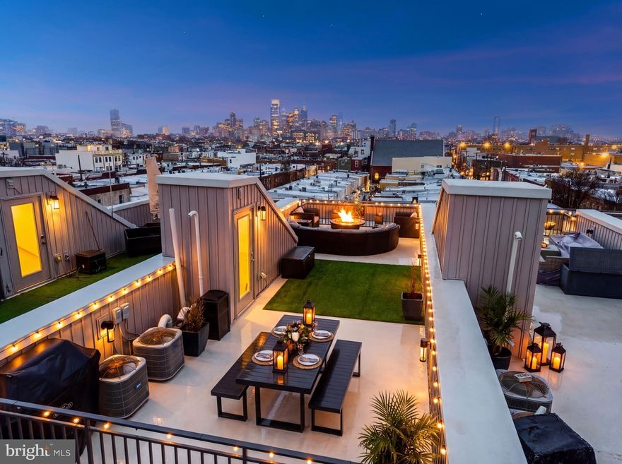 Welcome to Roman Square — an architecturally distinguished, design-forward townhome nestled in the heart of East Passyunk Crossing, crafted by the acclaimed Canno Design. This home features 3 beds (1 den/office/additional bedroom), 3.5 baths, approximately 4.5 years left on a FULL 10 year tax abatement, and GARAGE PARKING. Dark, wide-plank hardwood floors run throughout, creating a warm, cohesive feel across every level. Walking in through your front door you'll have a sitting area for shoes with a large coat closet and designer styled half bathroom. A 4th bedroom/office/den is located before the garage which can also be turned into a 2nd garage parking spot (some homes in the community opted for this). The wide, open-concept main living space with high ceilings on the 2nd floor offers excellent flow for everyday living and entertaining. The kitchen is outfitted with BOSCH stainless steel appliances—including oven/range, refrigerator, dishwasher, disposal, and built-in microwave (Sharp)—along with generous cabinetry and a huge island!

Upstairs, the third floor is dedicated to the primary suite, creating a true retreat with excellent natural light, a massive 17ft deep walk through closet with custom closet organizers, and a beautifully finished bath featuring double vanity sink, linen closet, toilet room, and subway tile shower with bench and glass enclosure and penny tile flooring. The 4th floor features two well-proportioned bedrooms, two full bathrooms (one ensuite), and a conveniently located laundry closet with stacked LG washer and dryer. Additional highlights include a built-in wet bar with beverage cooler, wine fridge, and ceramic tile accents.

At the top, a private roof deck provides the perfect outdoor escape—ideal for relaxing evenings or hosting friends with Philadelphia skyline views. All of this is just steps from East Passyunk Avenue’s acclaimed restaurants and cafes including Le Virtu, Ember and Ash, El Chingon, Barcelona Wine Bar, Townsend, Stargazy, Stateside, Human Robot, Rival Bros Coffee, City Fitness and much more! With convenient access to the Broad Street Line, I-76, and I-95, commuting throughout Philadelphia and beyond is seamless. A well-designed home in one of the city’s most walkable and vibrant neighborhoods—offering the space, parking, and outdoor living today’s buyers are searching for.