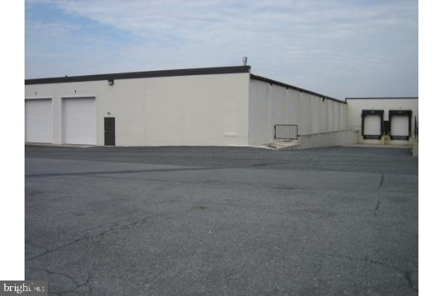 7072+/- sq. ft. Sprinkler, Natural Gas Heat, Light Mfg./Distribution area w/14 ft. clear span ceiling height, floor drain. Walk-in Entrance Door, Drive-in 12'x12' overhead door, 12'x12'overhead grade level door in rear, two loading docks. Restroom, 2-Supervisor's offices within warehouse area. AVAILABLE APRIL, 2014. Approx (150+/-)on-site parking, well maintained common restroom facilities & attractive curb appeal.