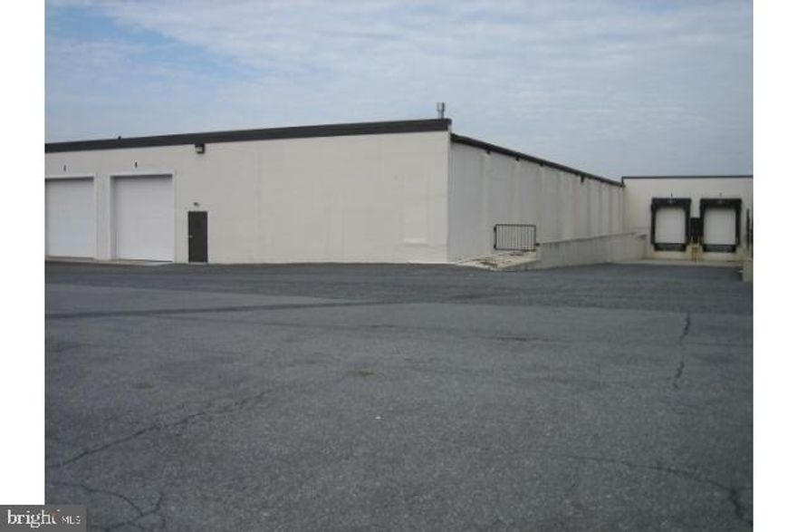 7072+/- sq. ft. Sprinkler, Natural Gas Heat, Light Mfg./Distribution area w/14 ft. clear span ceiling height, floor drain. Walk-in Entrance Door, Drive-in 12'x12' overhead door, 12'x12'overhead grade level door in rear, two loading docks. Restroom, 2-Supervisor's offices within warehouse area. AVAILABLE APRIL, 2014. Approx (150+/-)on-site parking, well maintained common restroom facilities & attractive curb appeal.
