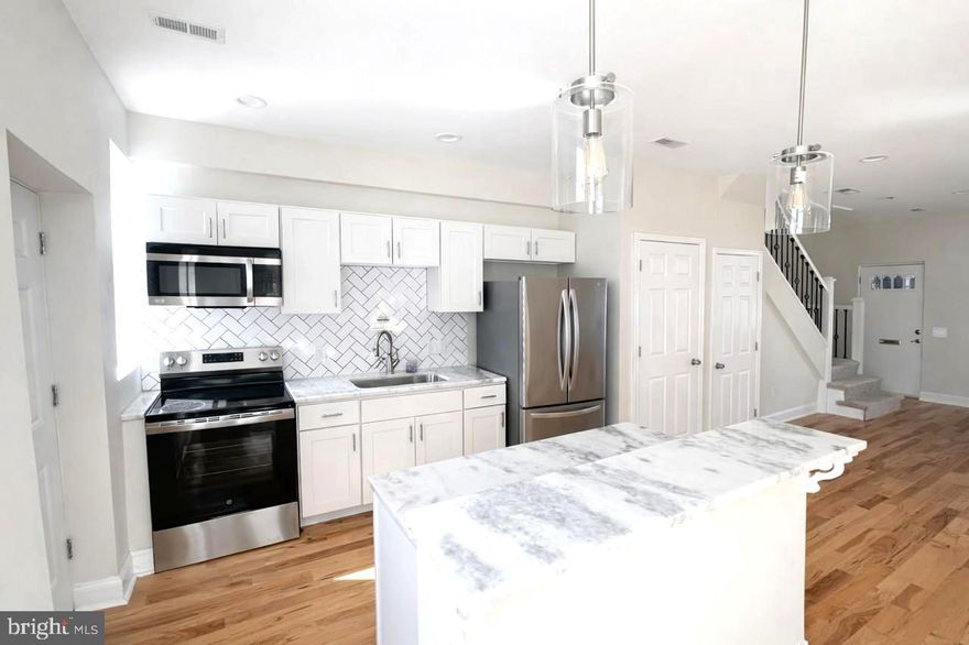 *****Opportunity Knocks!!!**** Move right into this beautifully updated 3-bedroom, 1-bath home that truly has it all! Enjoy an open-concept kitchen featuring granite countertops and modern finishes, perfect for entertaining or family gatherings. The main level boasts gleaming hardwood floors, while the upper level offers newer carpet for added comfort. The updated bathroom adds a fresh, stylish touch. Outside, you’ll love the private backyard parking, plus plenty of additional off-street parking in front. Conveniently located near shopping, dining, and major highways, this home is move-in ready and waiting for you!