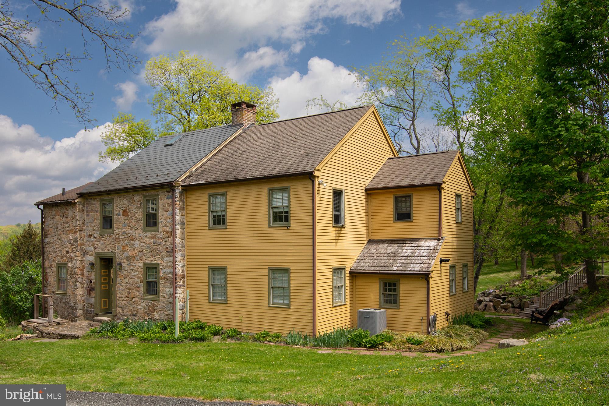Step into a harmonious blend of historic charm and modern convenience with this stunning 4-bedroom, 2.5-bath home, set on a picturesque 2 m/l-acre, park-like property. This circa 1750 home boasts exposed beams, stone walls, cedar siding, and character-rich wide plank pine floors. The inviting foyer features a walk-in fireplace, creating an ambiance that speaks to the home's deep-rooted history. An expansive addition built in 2003, seamlessly integrates contemporary living with the home's timeless appeal. The modern kitchen is a chef’s delight, featuring granite countertops, recessed lighting, a high-end gas stove, and an abundance of natural light. Beautiful maple flooring showcase much of the first floor maintaining warmth and character throughout. Mechanical updates ensure year-round comfort, with two-zone heating, central air, and propane heat. Outside, the tranquil setting offers mature landscaping and open spaces perfect for relaxation and entertaining. This one-of-a-kind residence is a rare gem, where history meets luxury in an idyllic setting. Schedule your tour today and experience its unique charm firsthand!